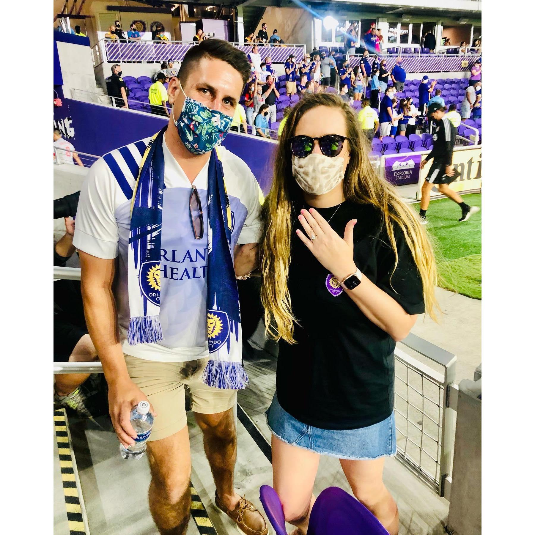 Doug proposed before one of our favorite events, an Orlando City Soccer Club game!