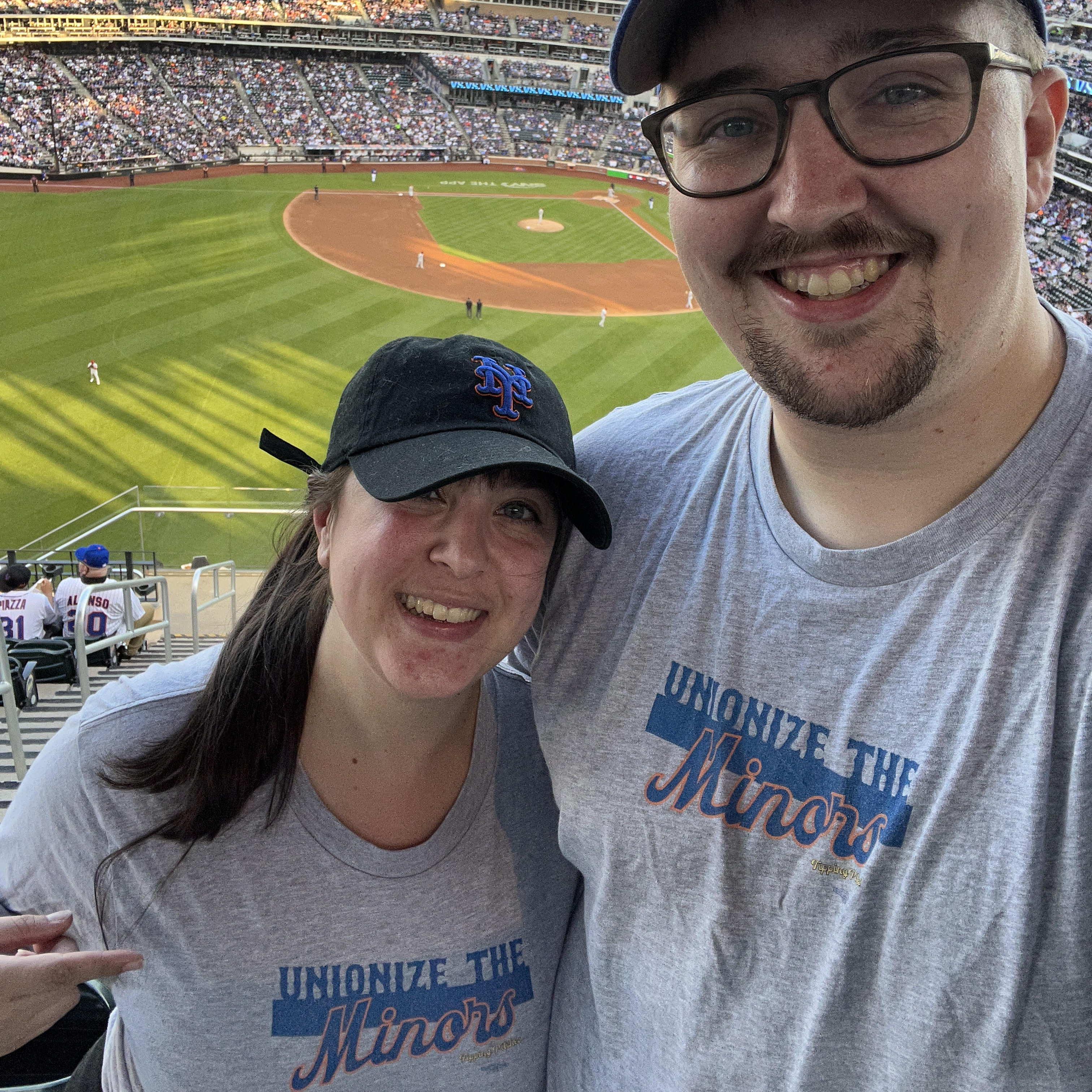 Wearing "Unionize the Minors" t-shirts at a Mets game, May 2022. (The Minor League players successfully unionized later in the season!)