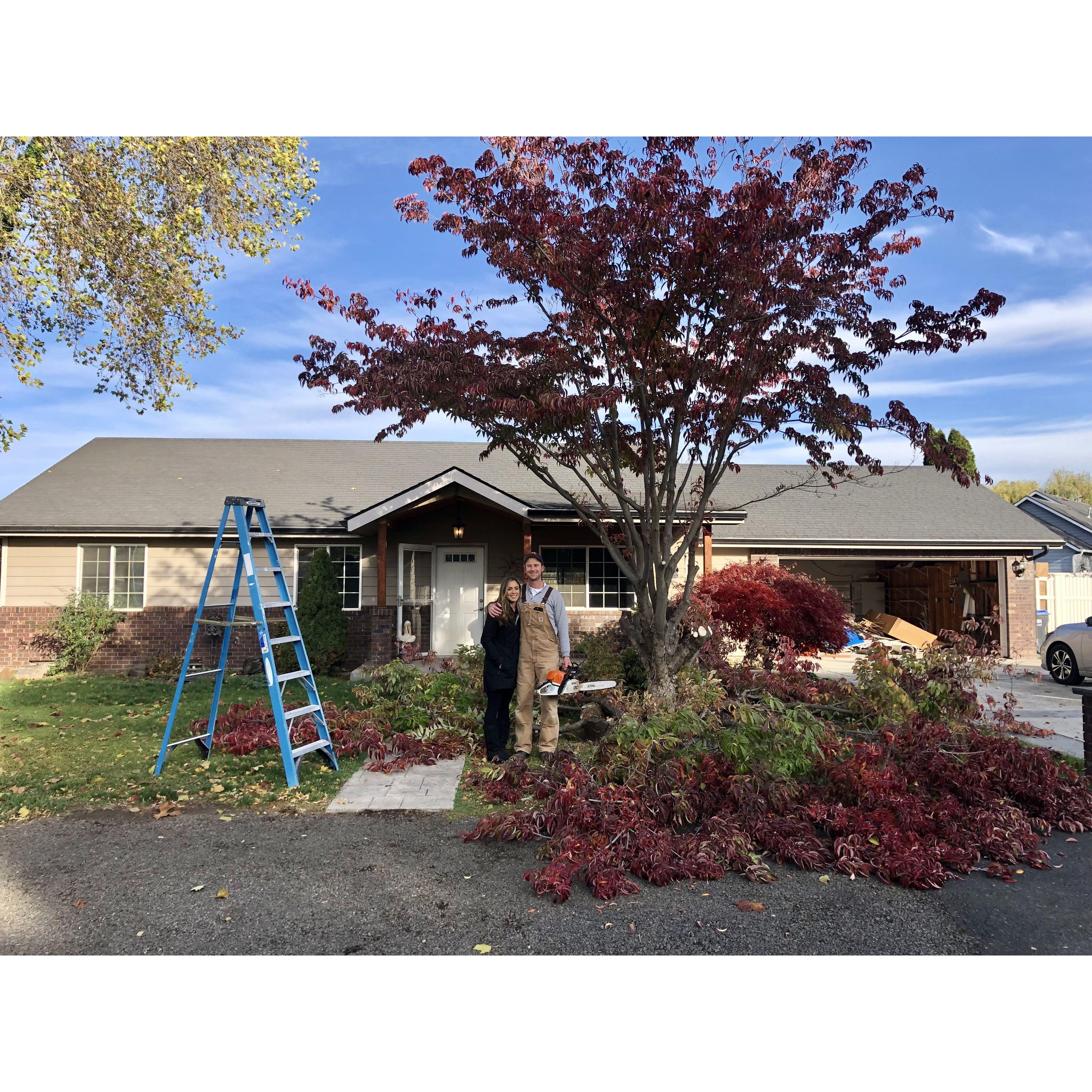 Michael bought the house and chopping trees! Come look at how our house looks now if you get the chance!