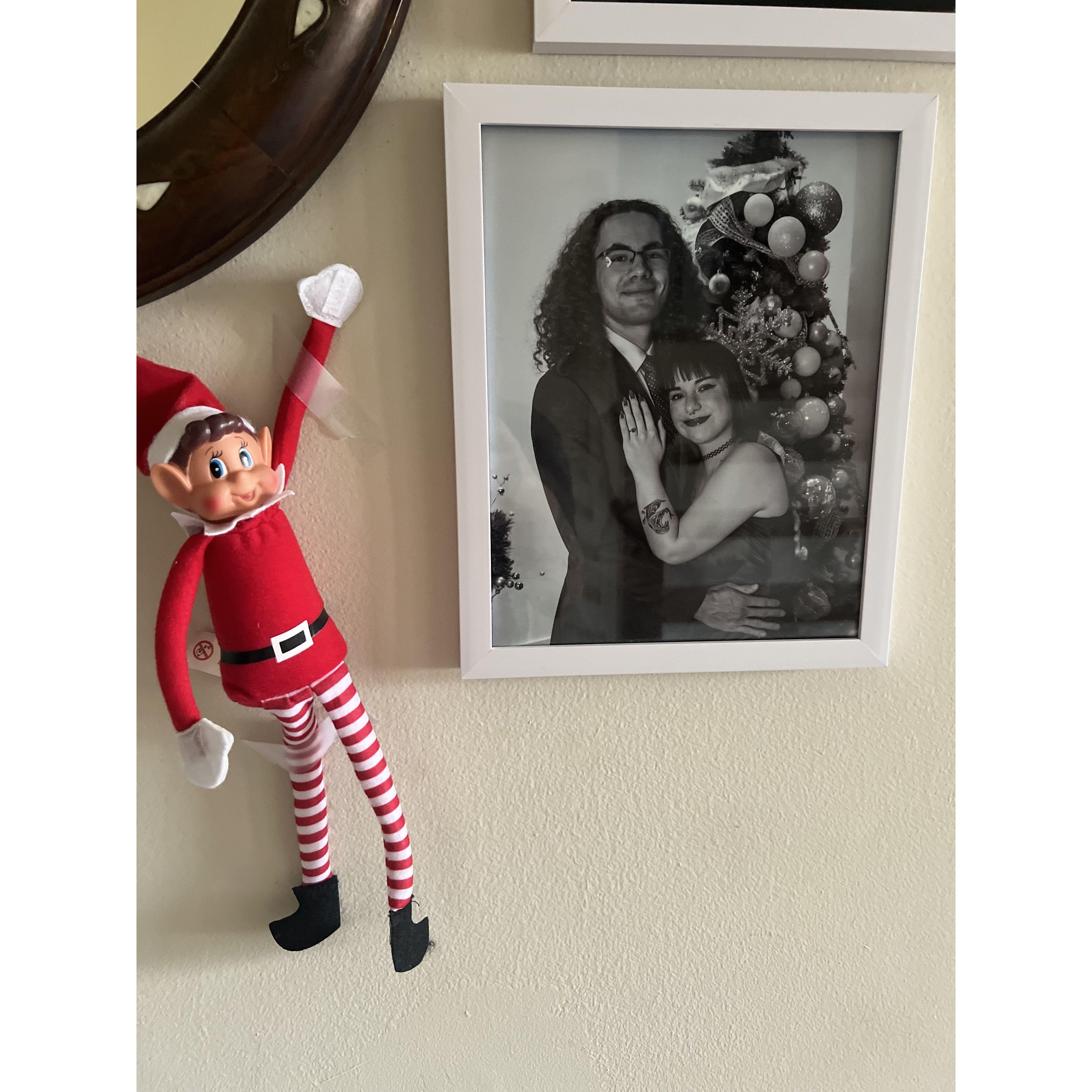 The naughty elf helped Jewel's mom replace her high school graduation picture to one of their engagement pictures.