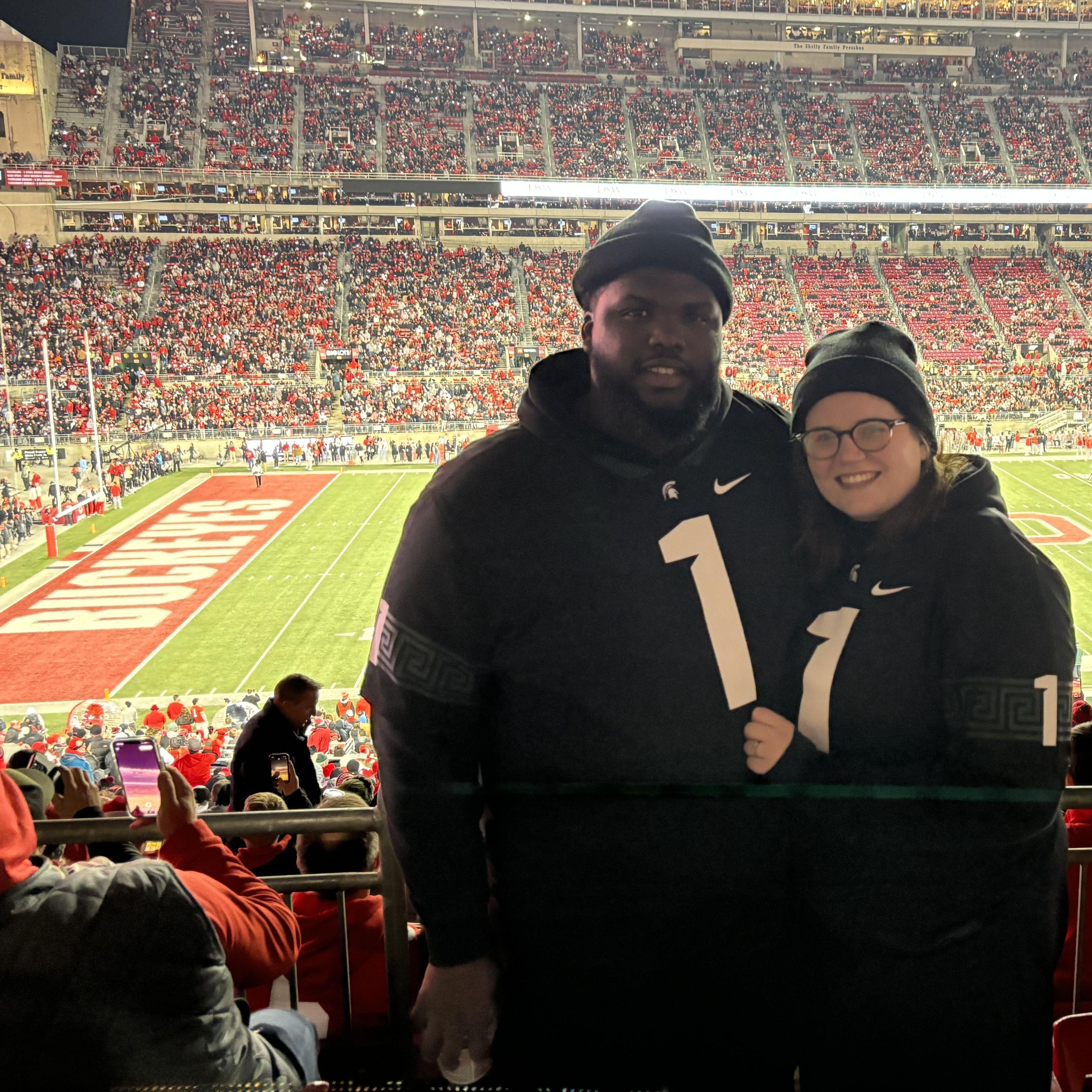 The only 2 people wearing green in our section at the Michigan State Game.