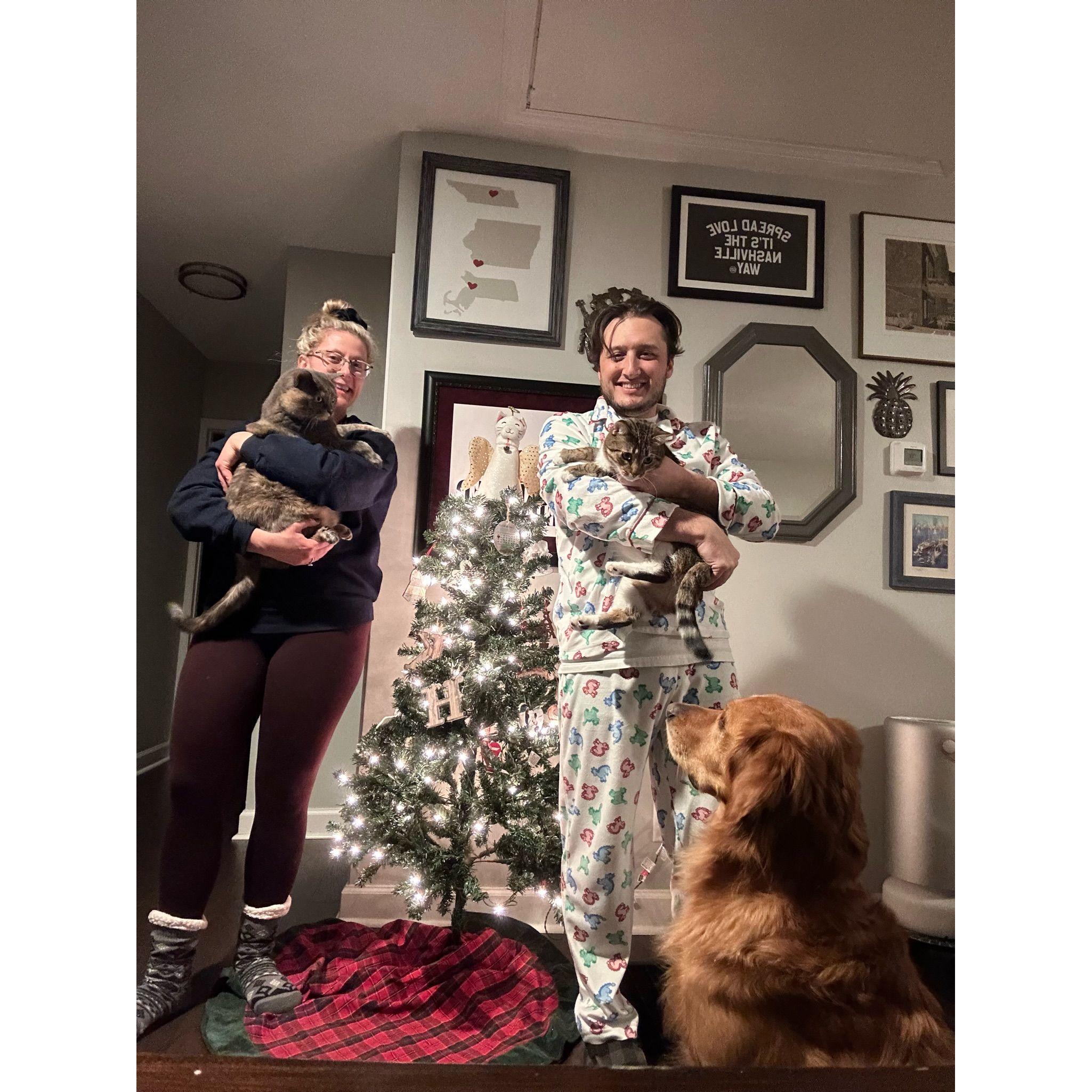 Christmas family photo, including Smolder (in Keely's arms), Tuck (in Shad's arms), and Husker (being the best boy).
