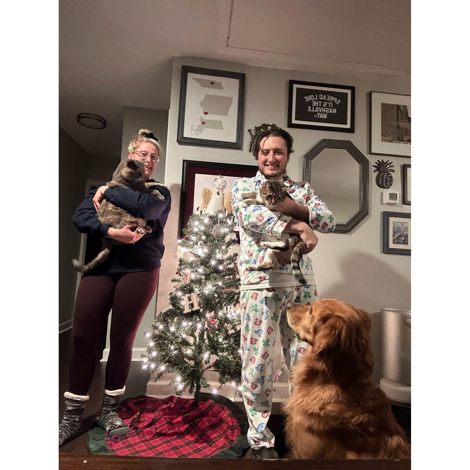 Christmas family photo, including Smolder (in Keely's arms), Tuck (in Shad's arms), and Husker (being the best boy).