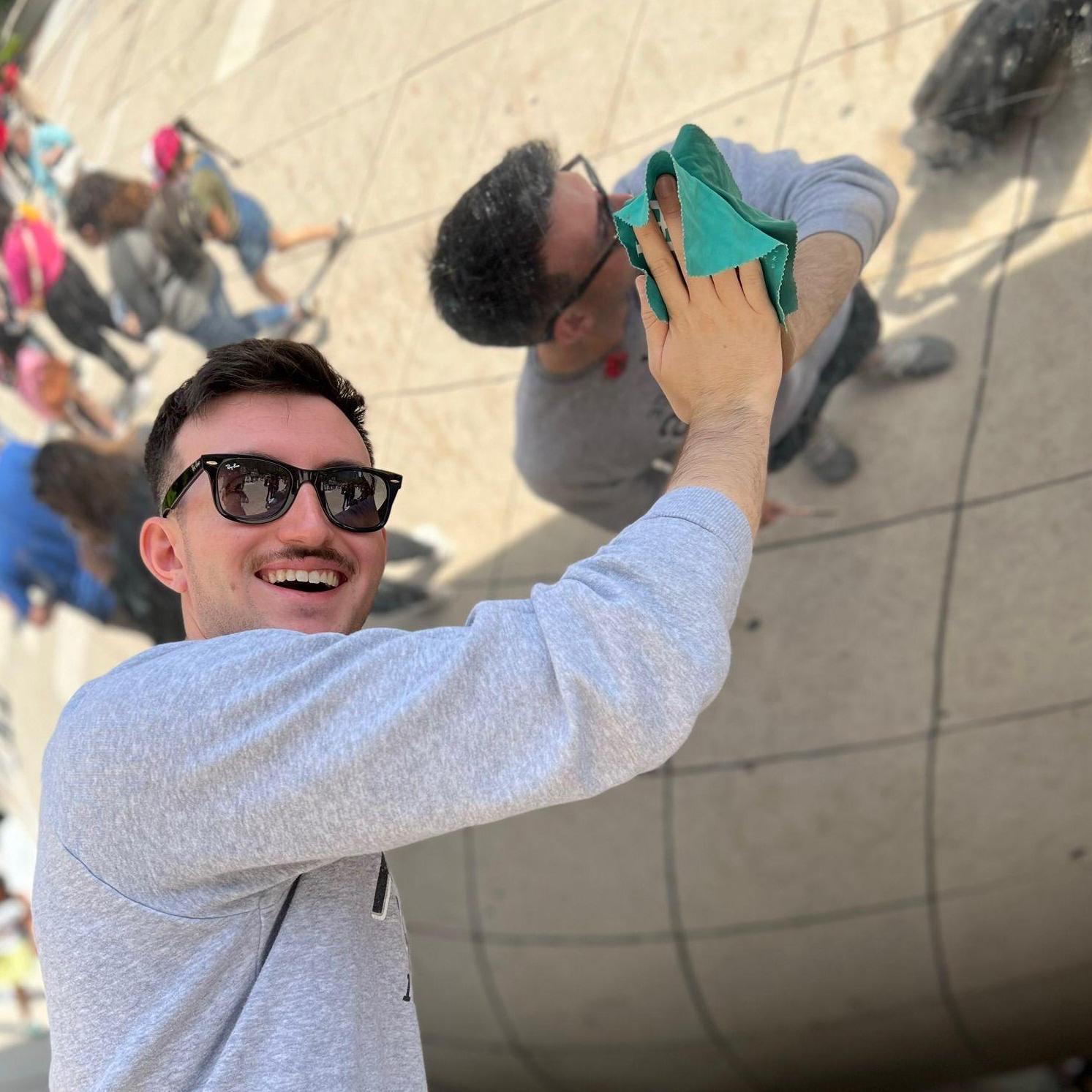 Brian polishing Cloud Gate ("the Bean") sculpture in Chicago