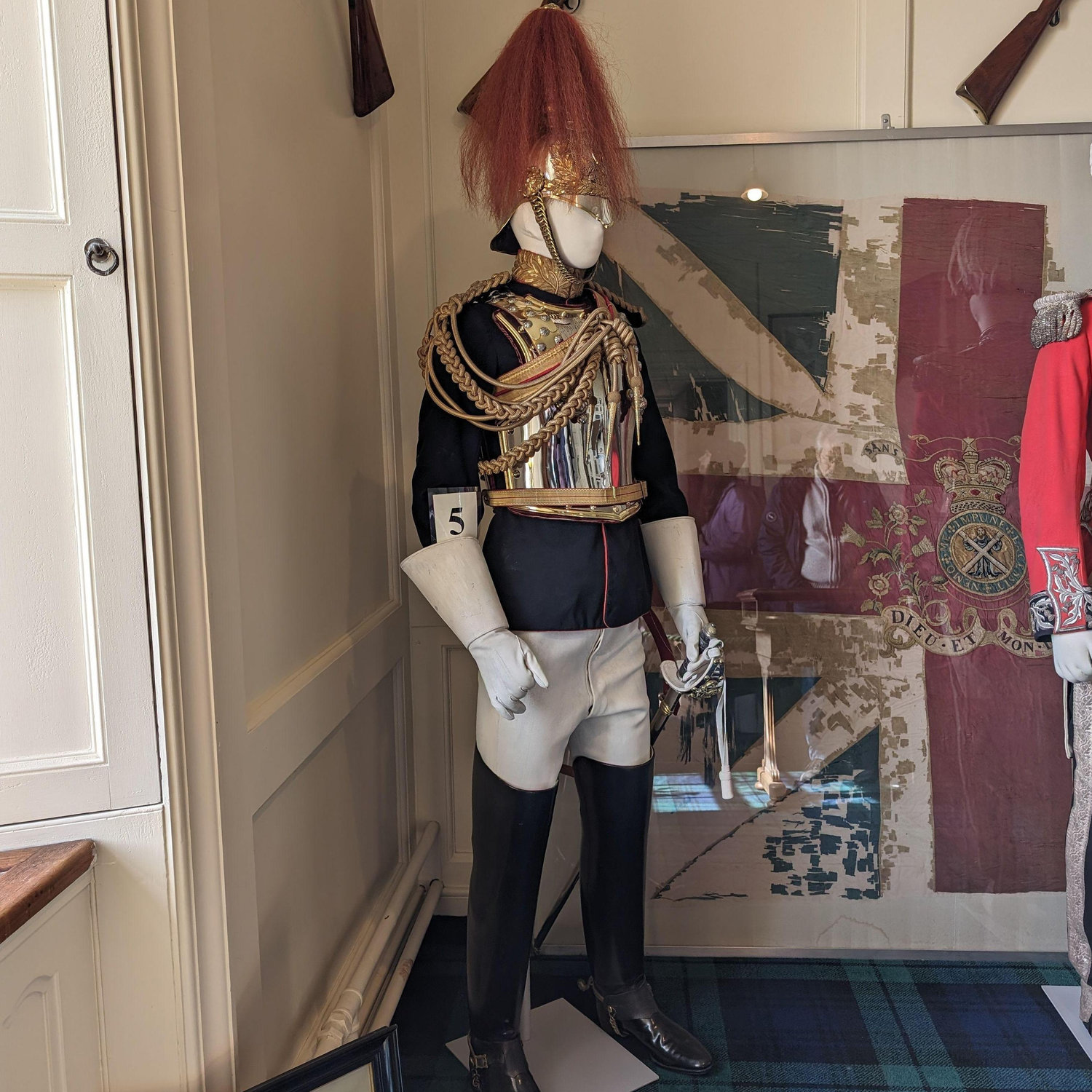 A military uniform with a metal chestplate.