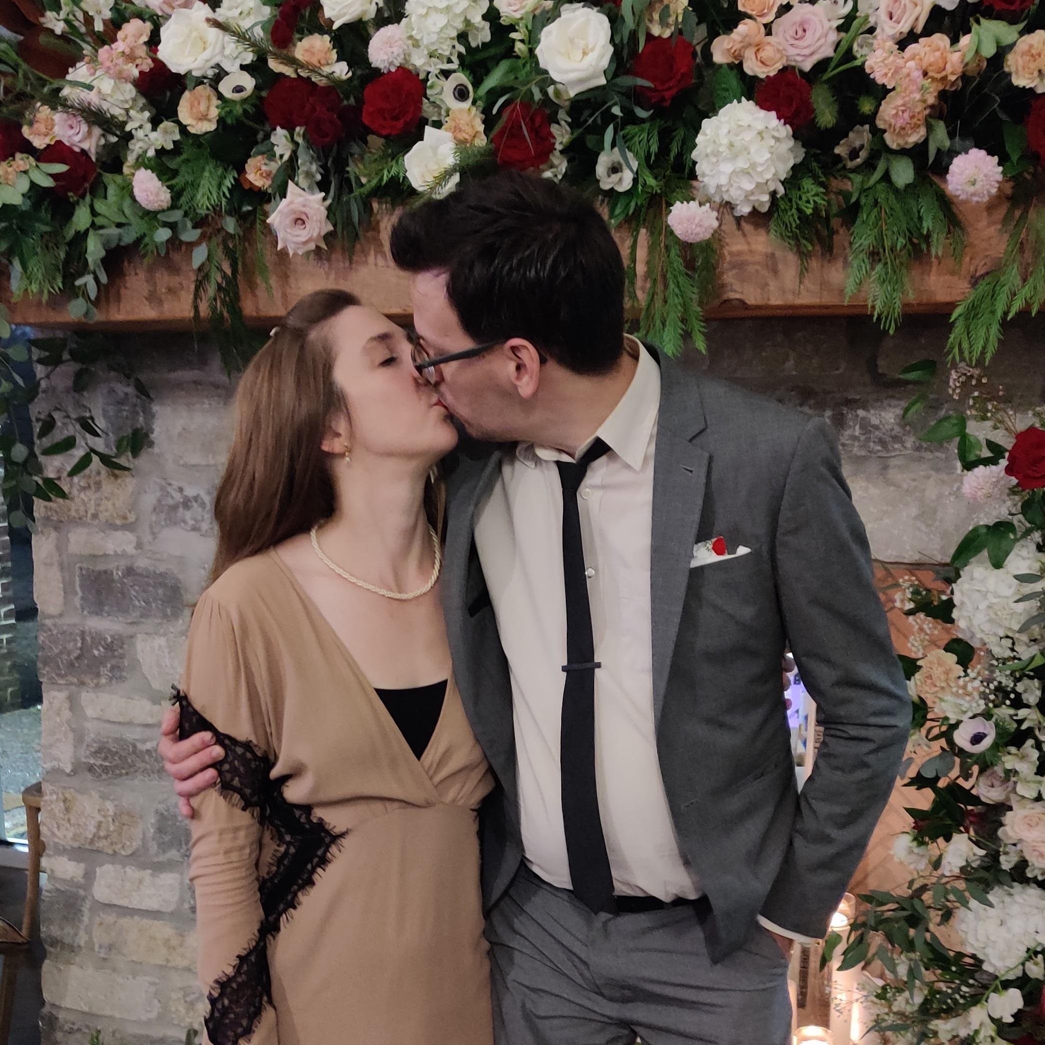 Posing for a romantic shot at a friend's wedding (and anticipating our own).