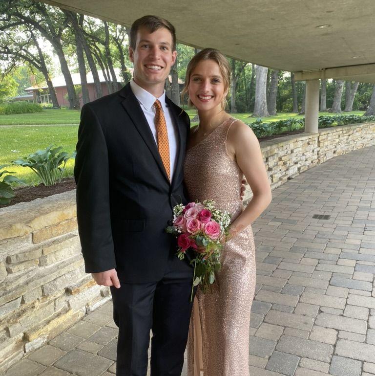 Us at Tim's wedding in 2023 where we welcomed Pavni into the Schwieterman family! Now it's our turn!