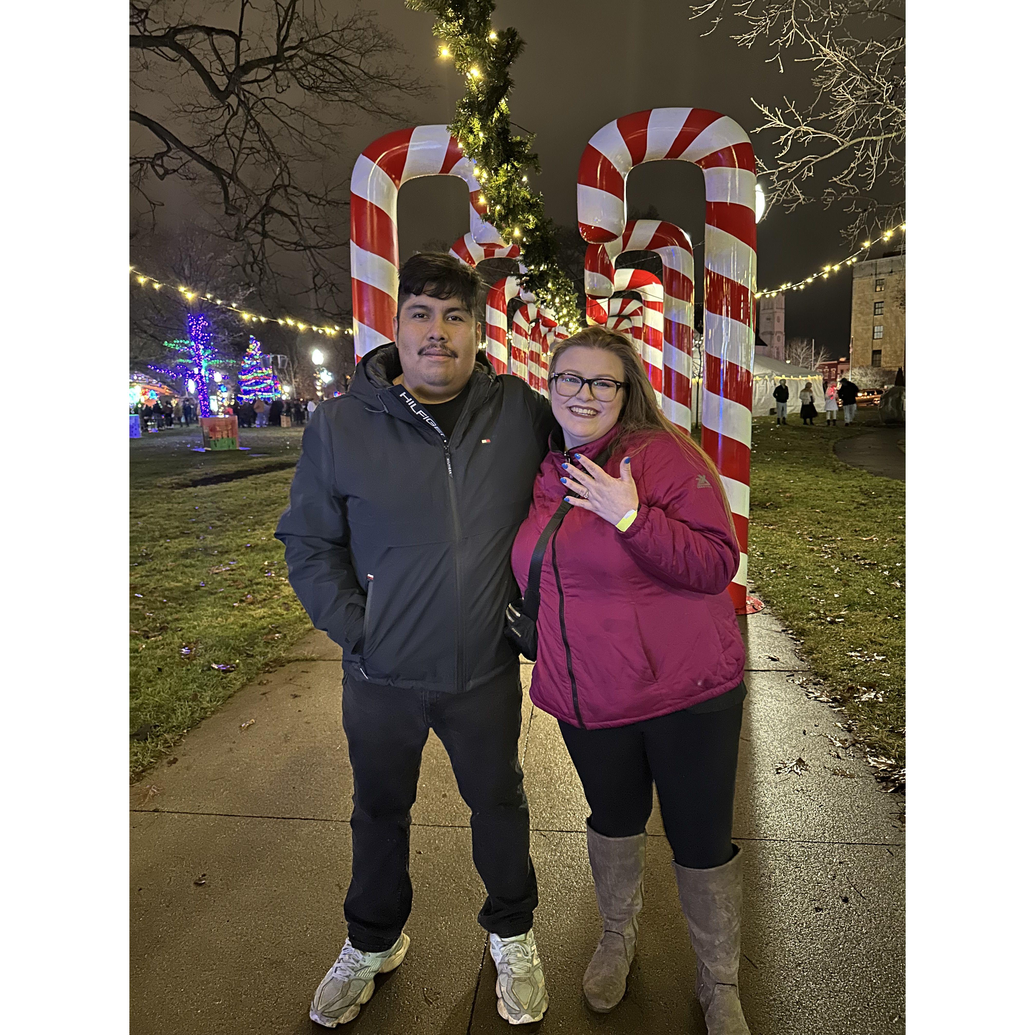New Year's 2024 when David proposed. He proposed at Baypoint Grille over looking the lake at night. We came back to Kalamazoo and had this picture taken before watching the ball drop.