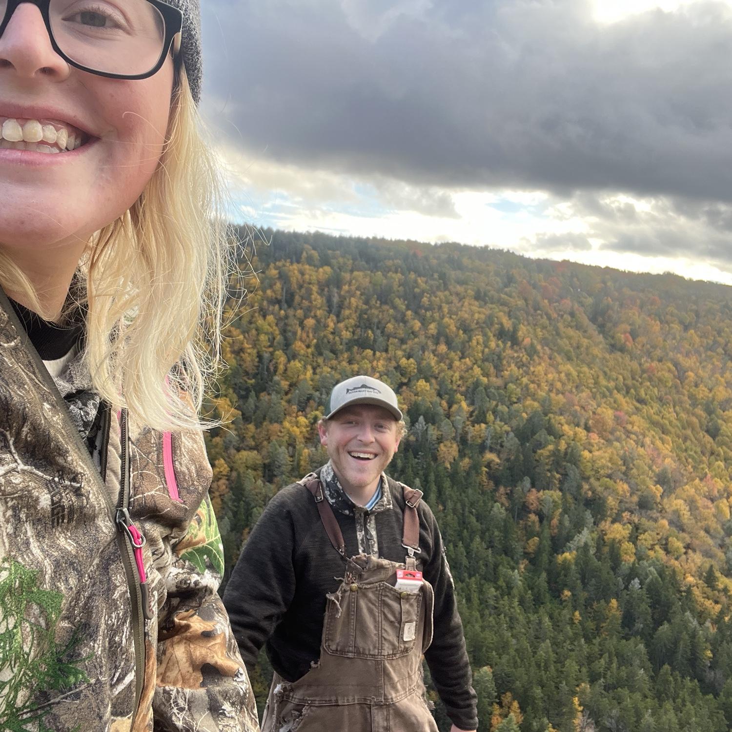 Gregory and Jess hiking in WV, taking in the fall season views.