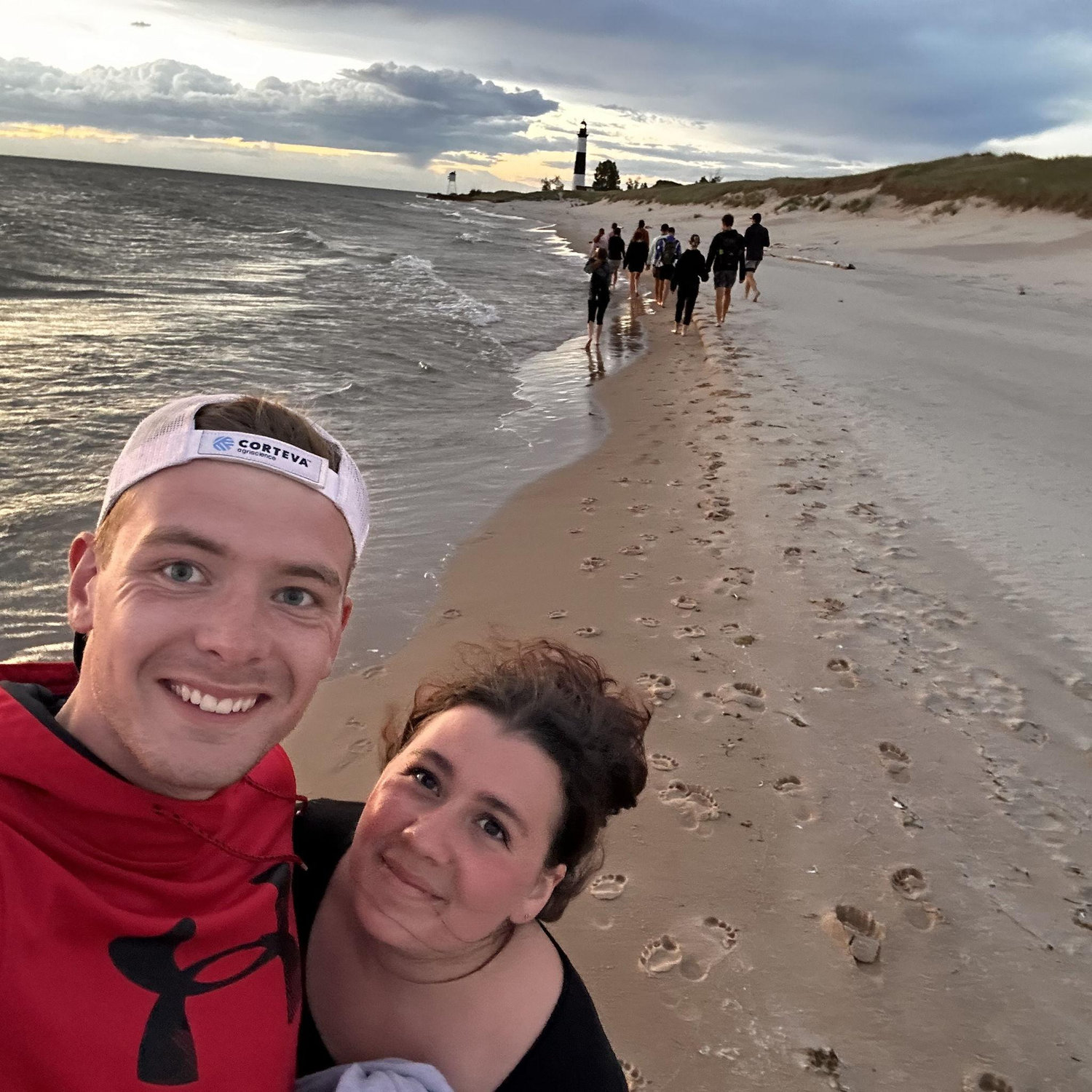 On a hike to the lighthouse in Ludington, lagging behind the pack to talk.