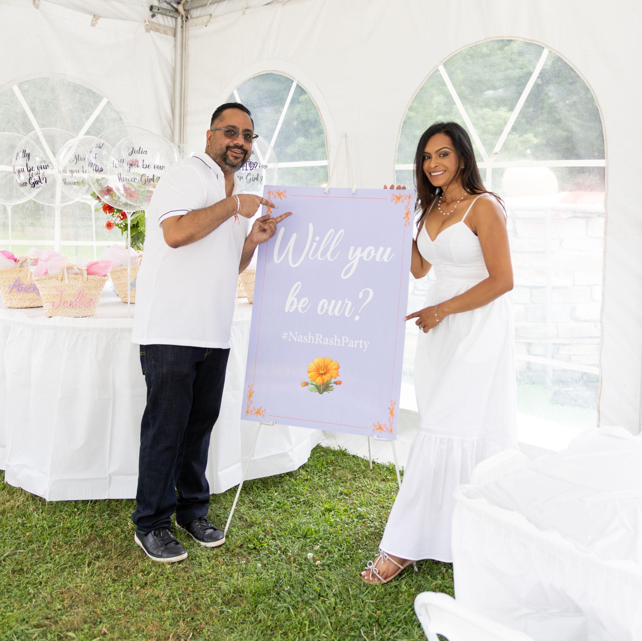Just two people trying to recruit the cutest flower girls ever.
