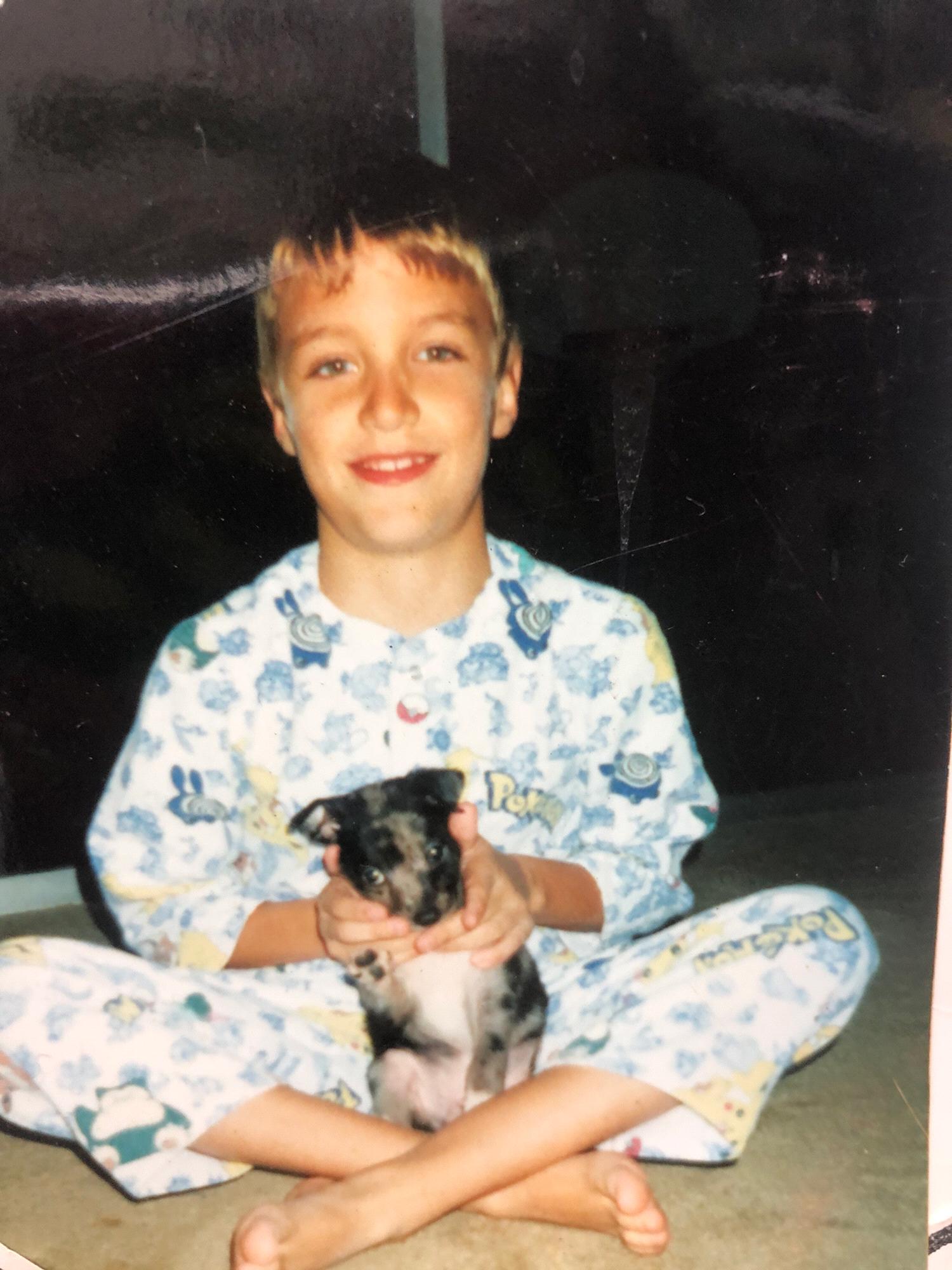 Conner with his childhood dog, Tornado