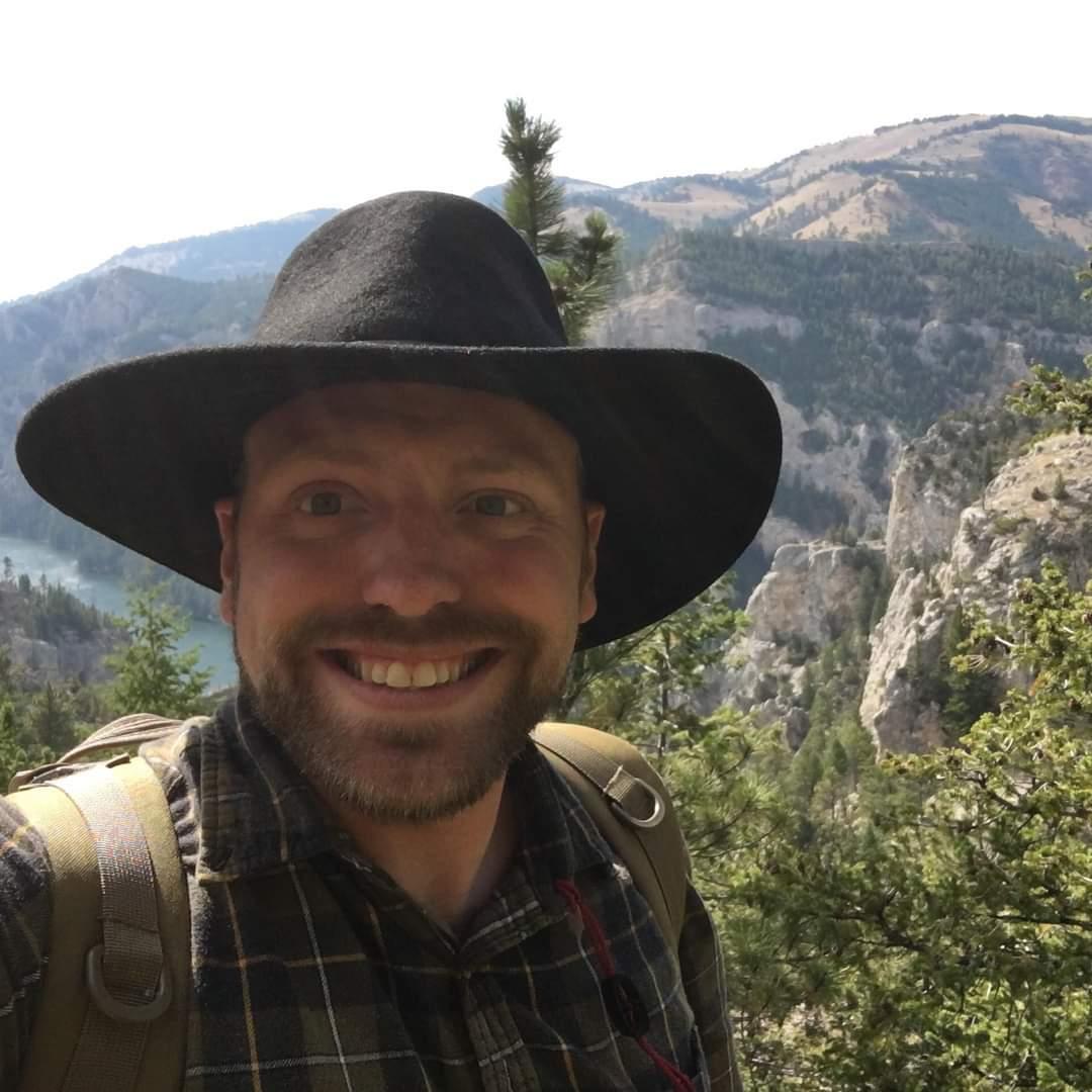Taking a picture while hoping he doesn't get lost at the gates of the mountains.