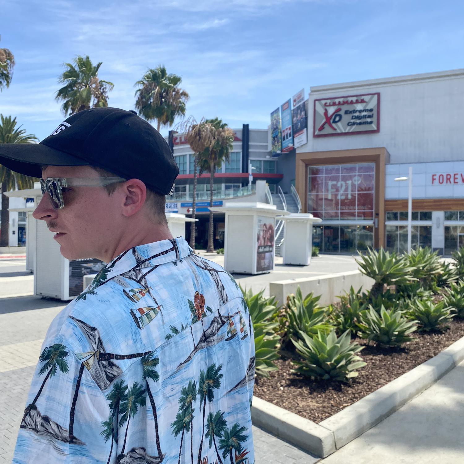 Travis browsing stores on the trip to Long Beach, California , where he would later pop the big question!