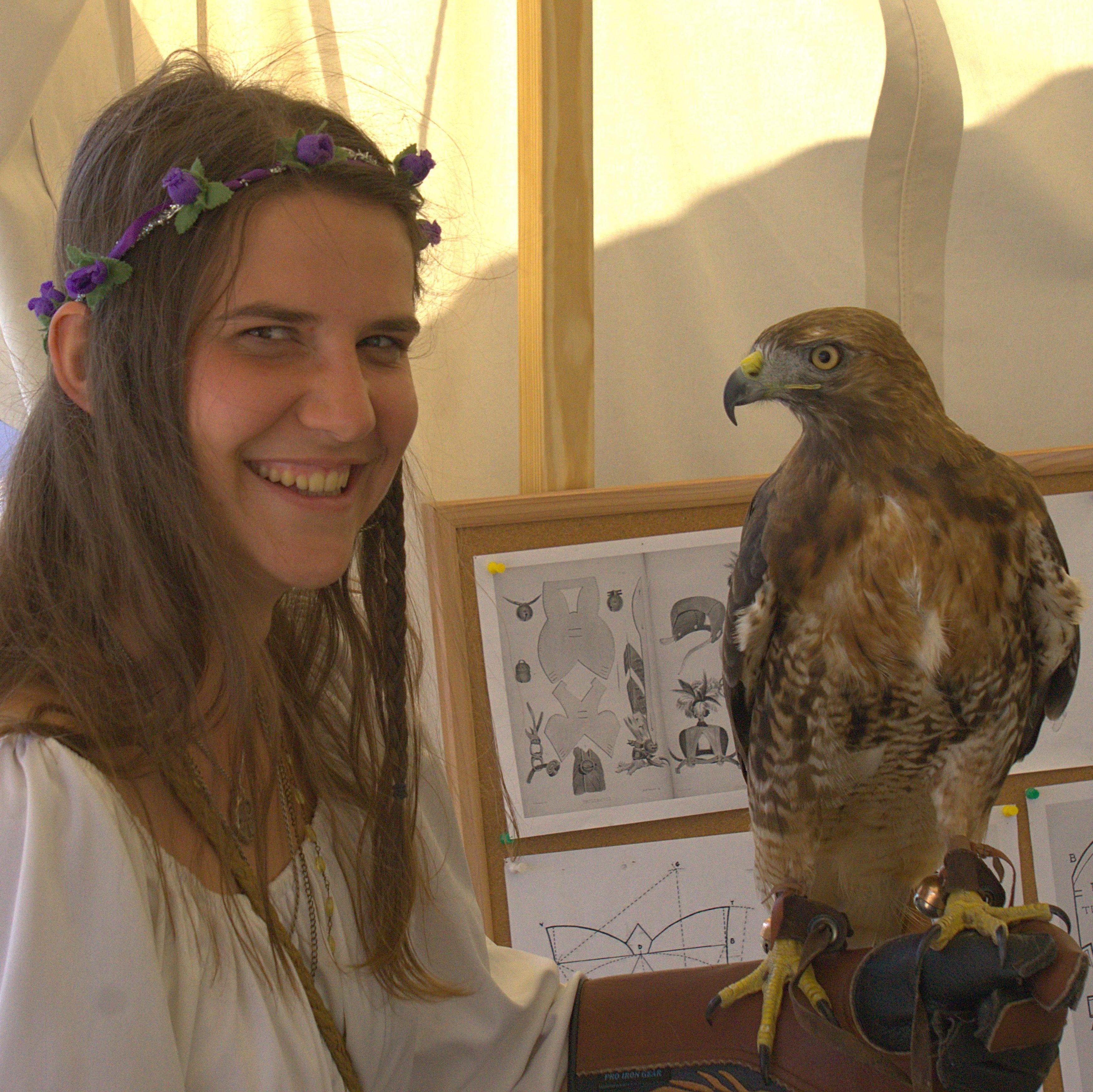 Having fun and holding hawks at the Renaissance fair. This was Aslan the red tailed hawk.