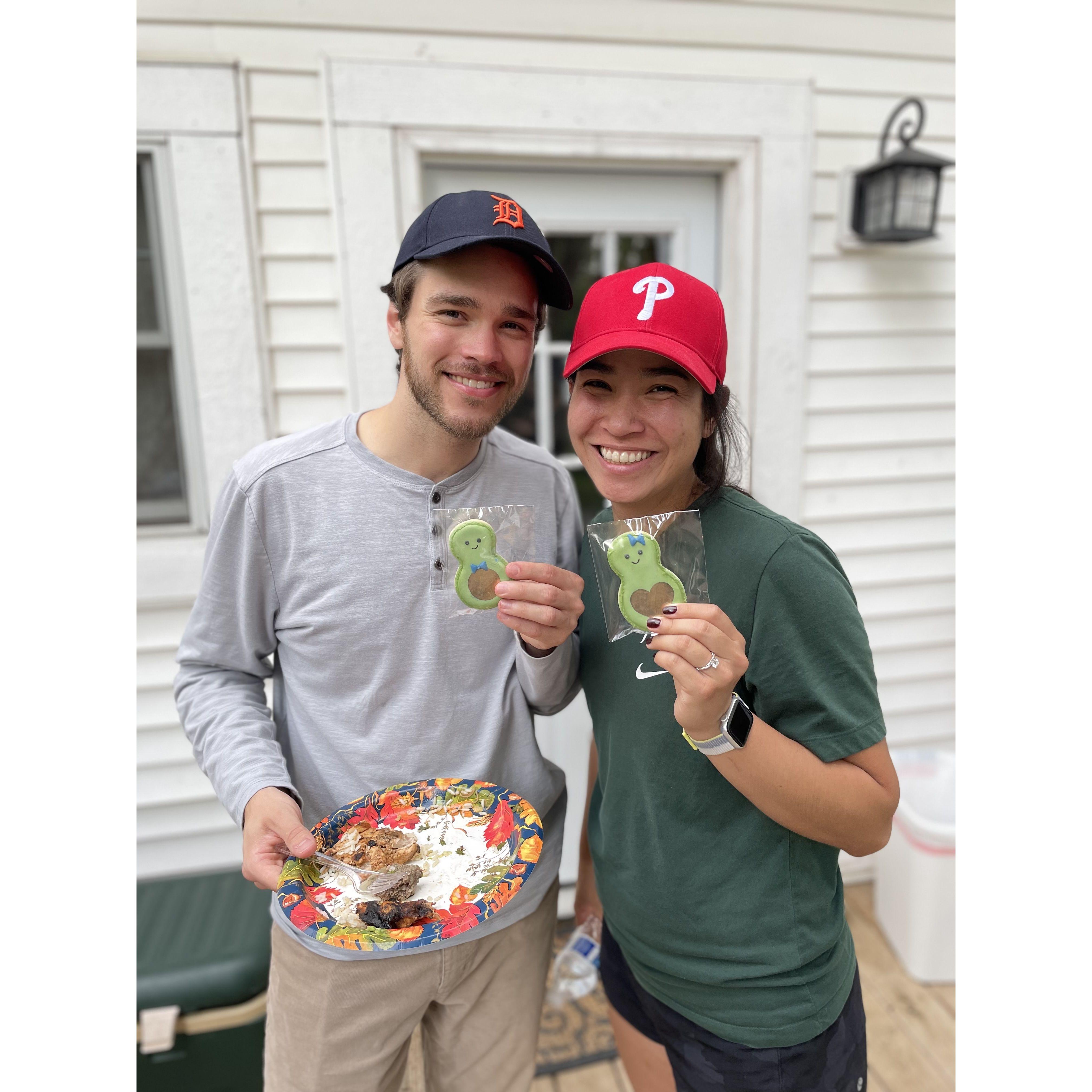 Sporting each others' team hat and thankful that they aren't in the same league.