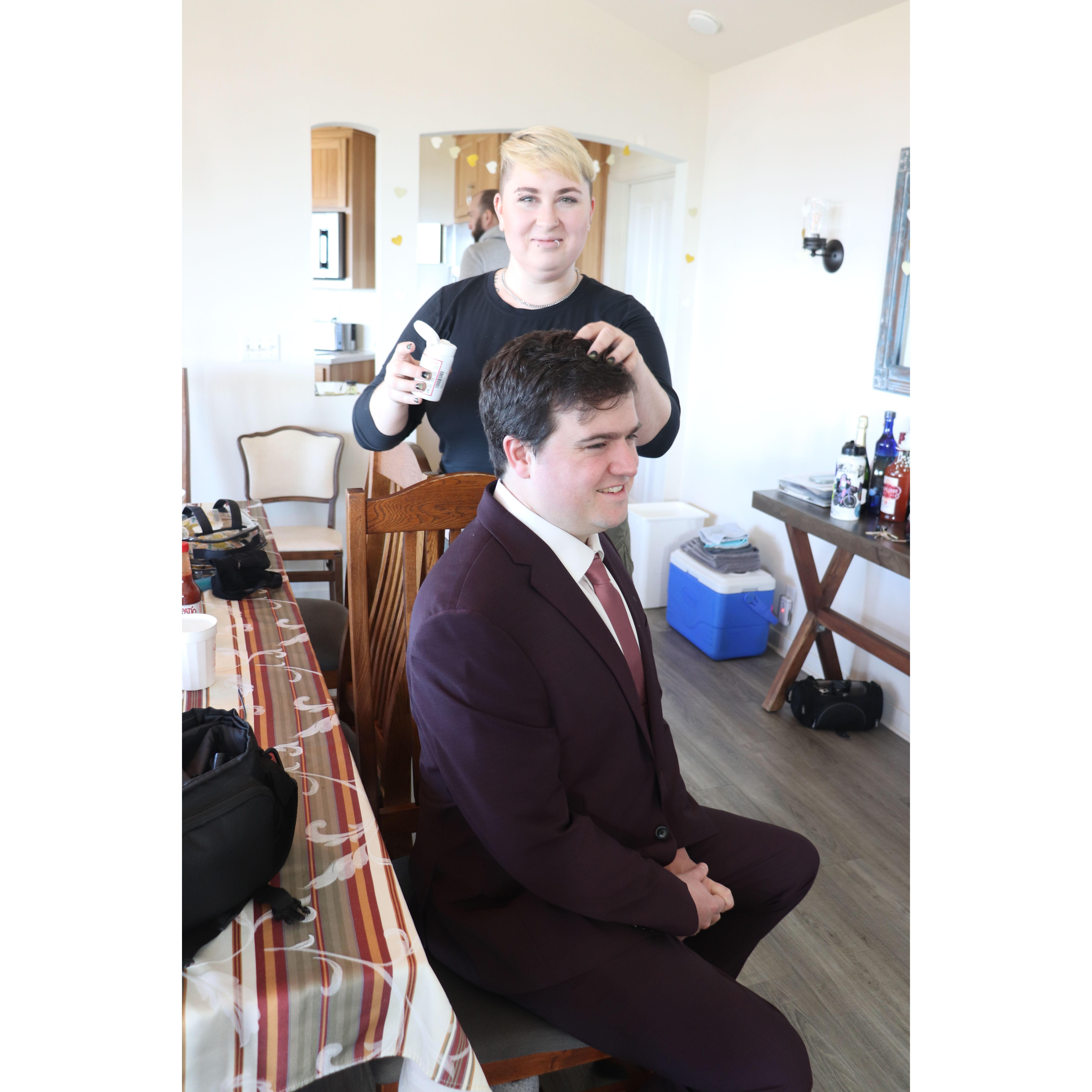 Maia helping Alex with his hair