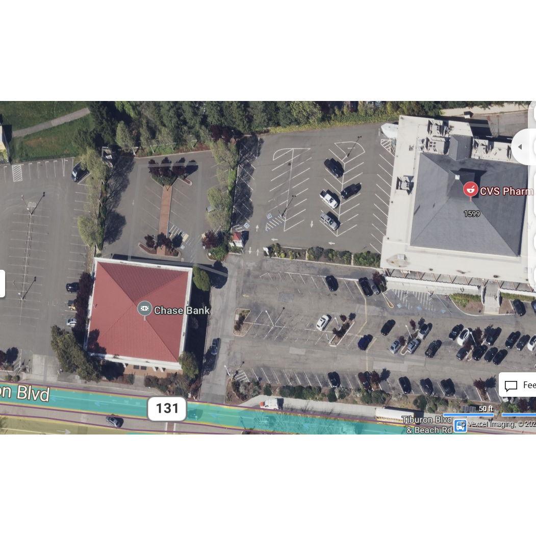 1555 Tiburon Boulevard.

The parking lot options around CVS and Chase Bank. Use the back square lots and avoid the main front lot. Just look for the Pure Luxury Transportation shuttle bus.