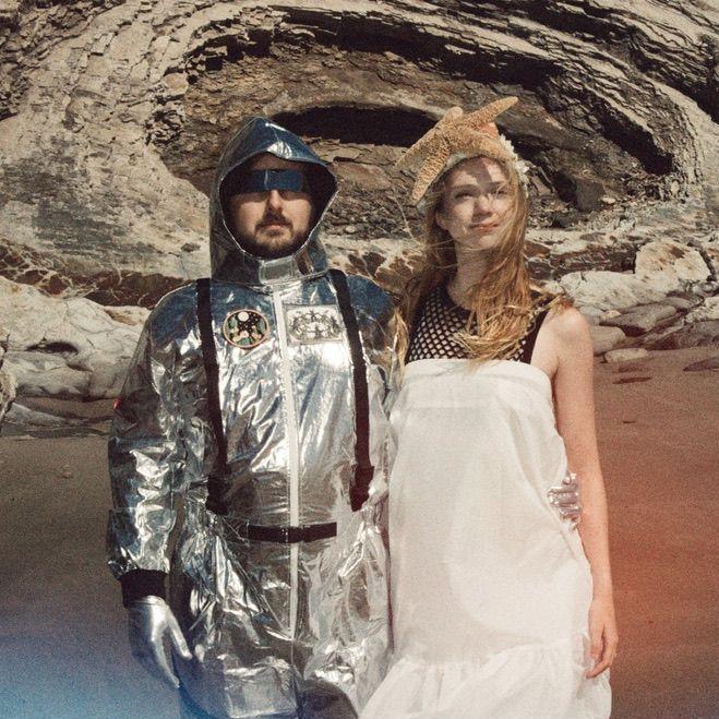 Follow her down to a bridge by a fountain, where rocking horse people eat marshmallow pies.