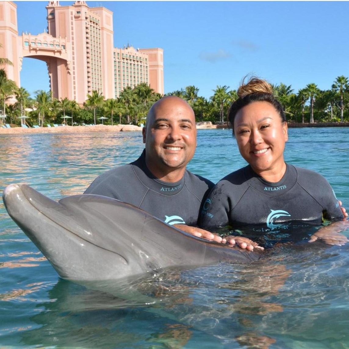 Us with Cherie the dolphin in Atlantis, Bahamas