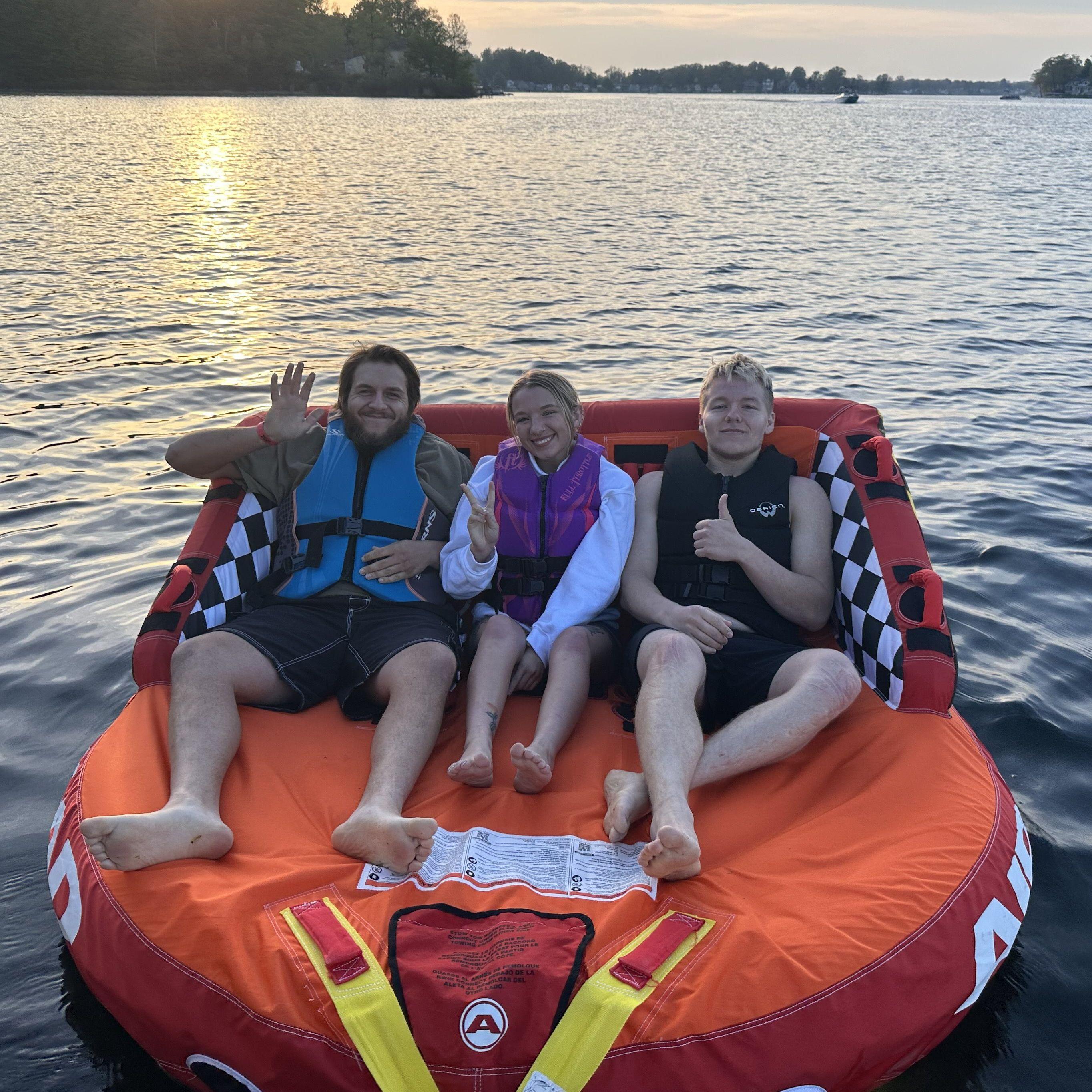 Ethan, Sydney and Athen tubing at the lake