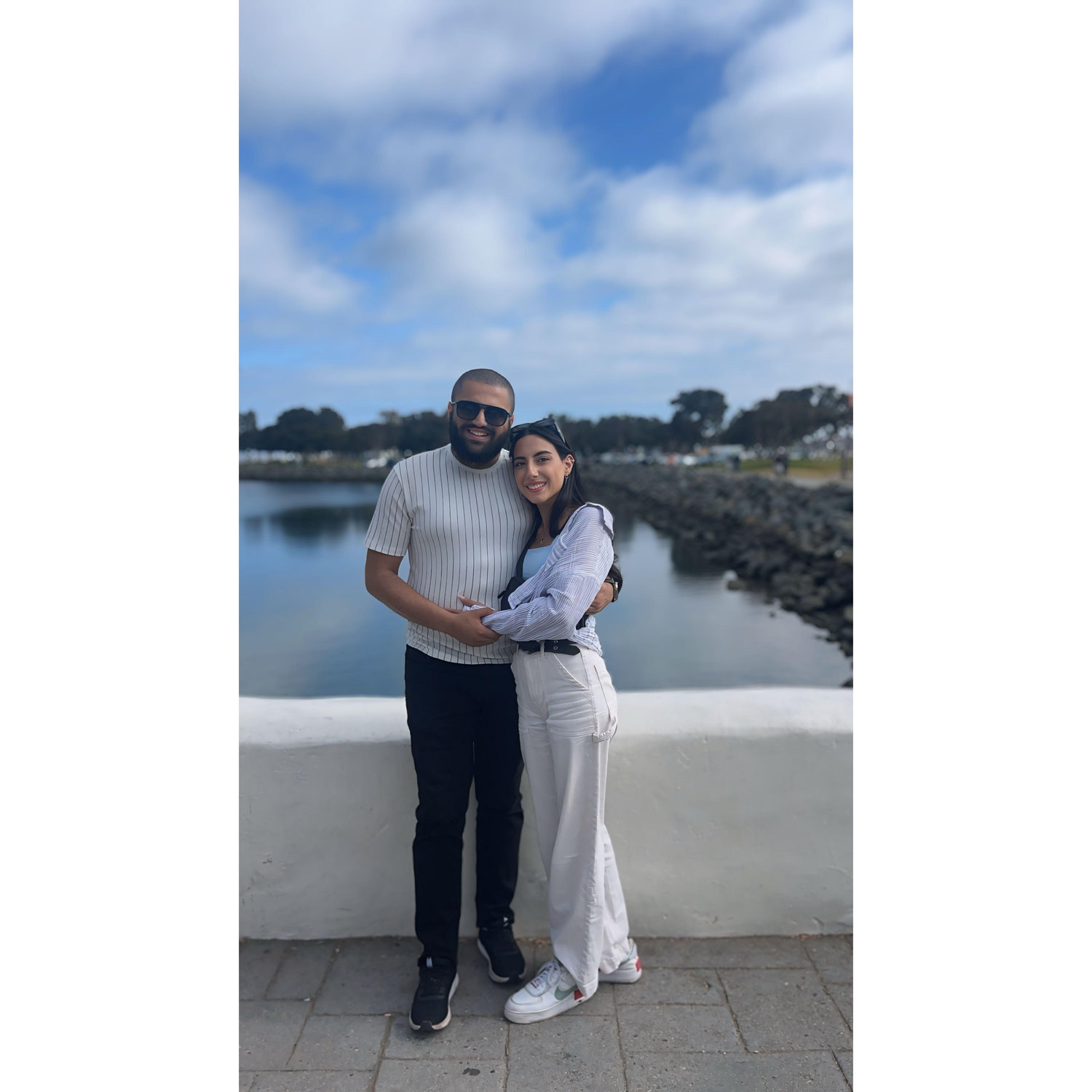 “Wrapped in each other, wrapped in the breeze — seaside serenity with my forever.”