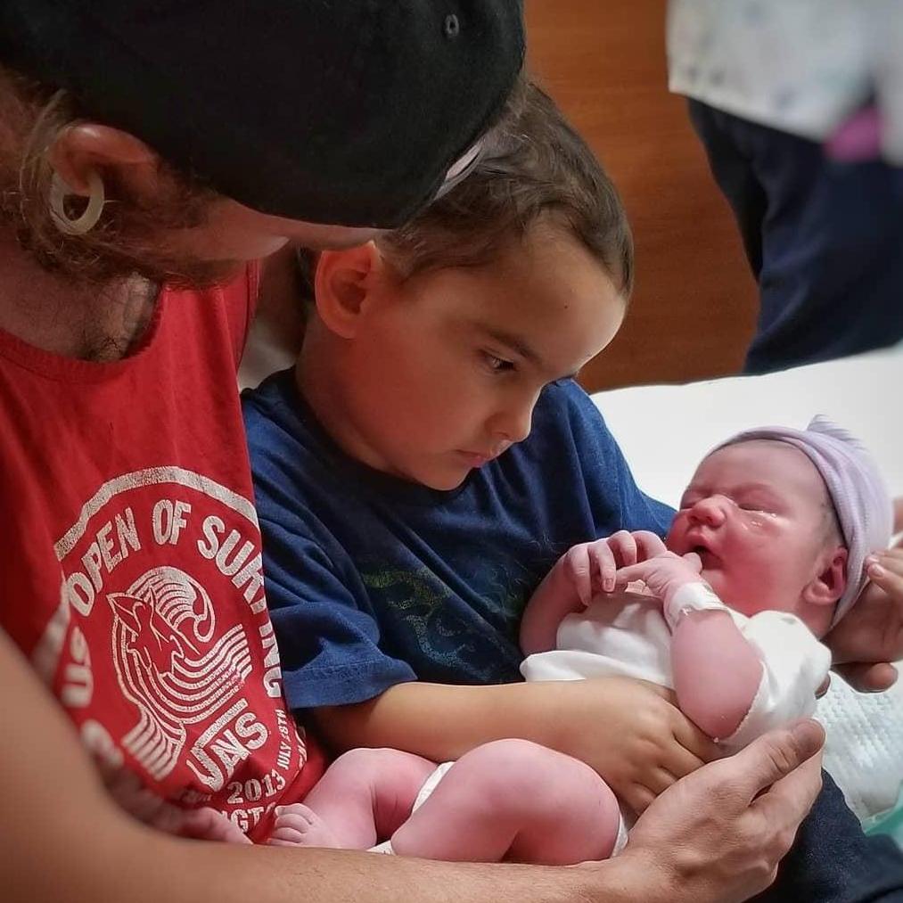 Orion getting to hold his new baby sister, Lyra. 9/30/2018