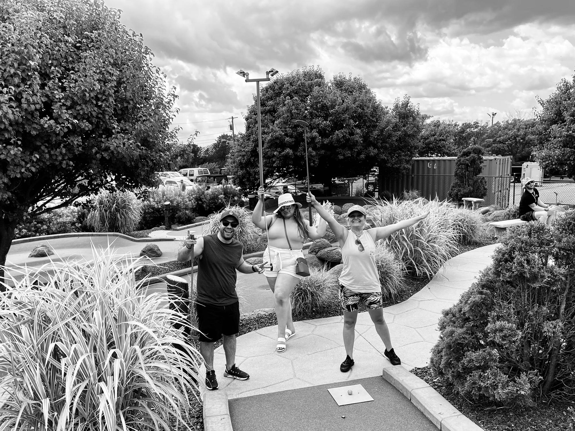 With Yosy and George playing some mini golf!