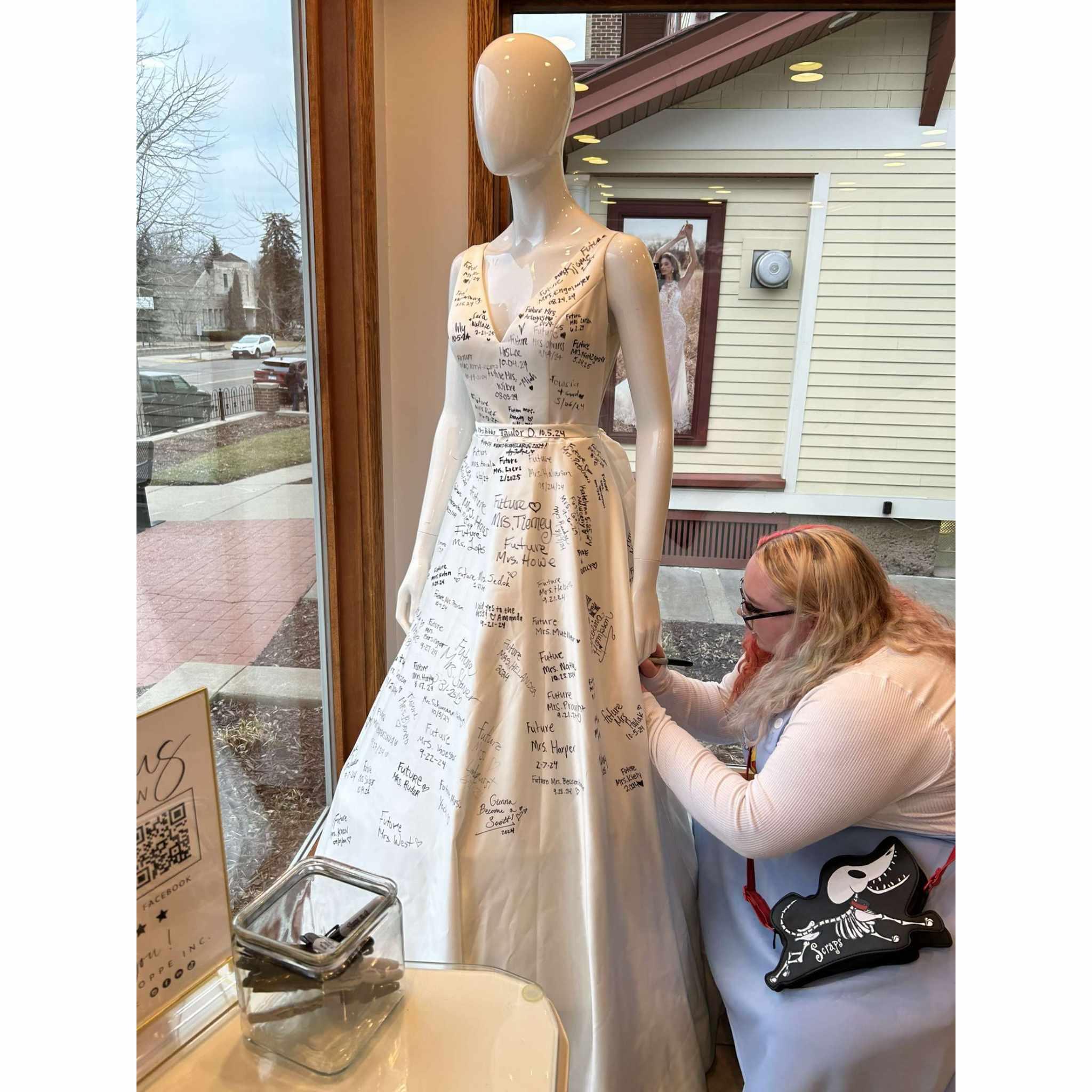 nat said yes to the dress, and got to sign her name on a dress they have at the store for those who purchase a dress