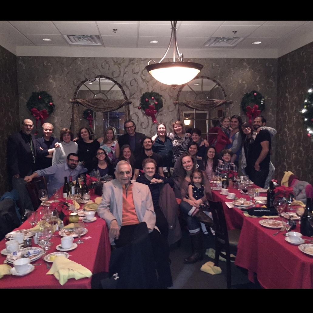 the whole family out to dinner celebrating christmas.