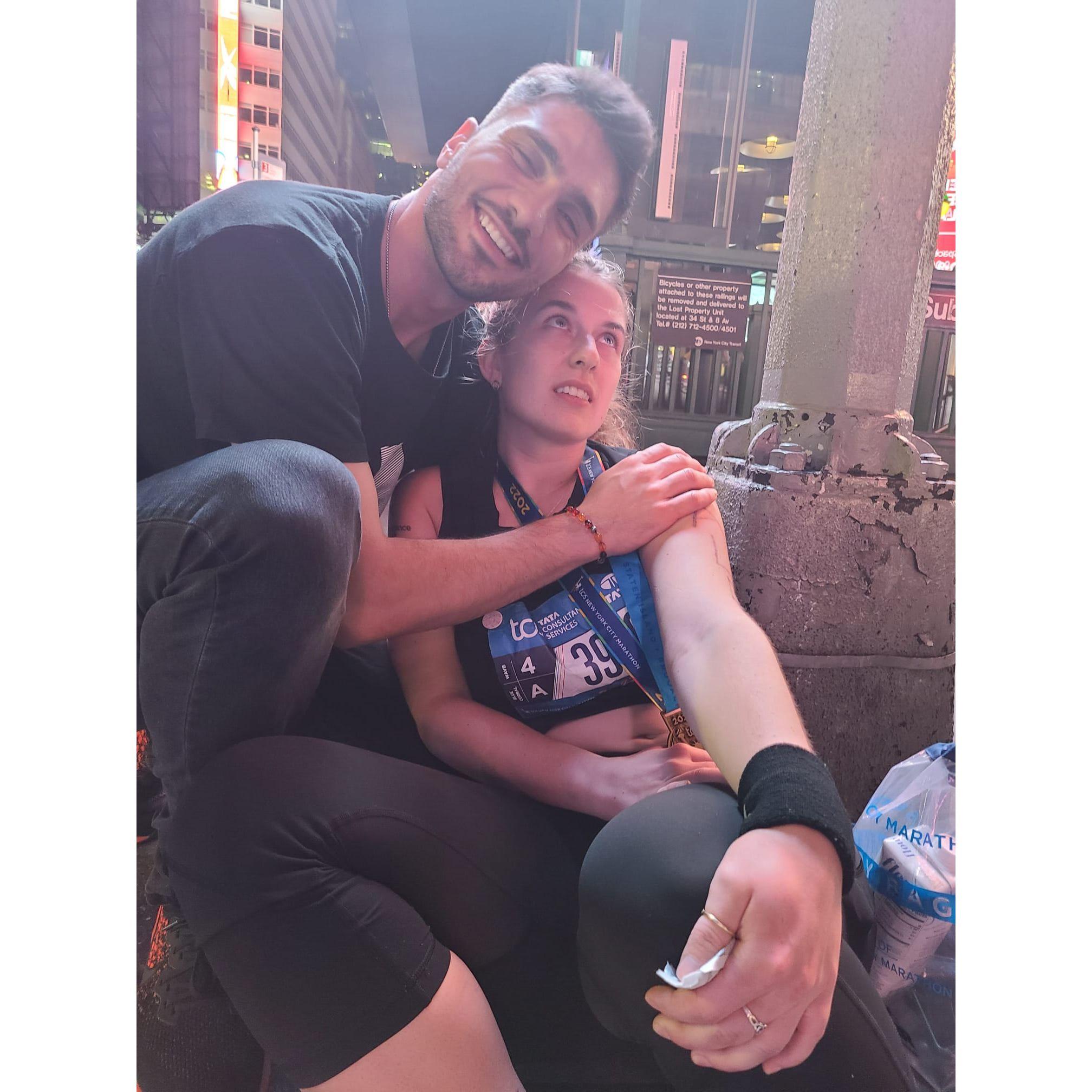 Emin taking care of Alex after her 1st marathon