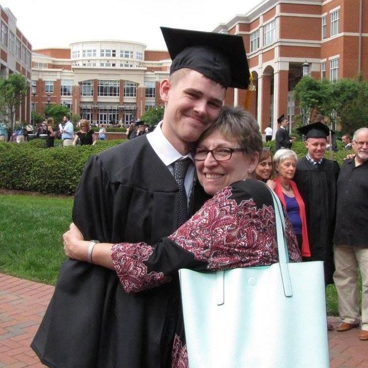 Casey celebrating his graduation with his mom, Loretta.