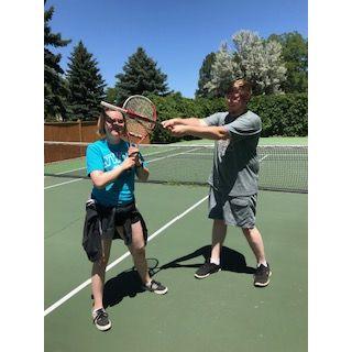 Playing tennis and being goofy