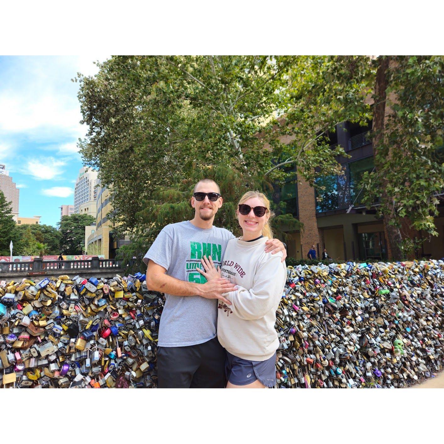 The day after we got engaged, we locked our lock on the love bridge and threw away the key!