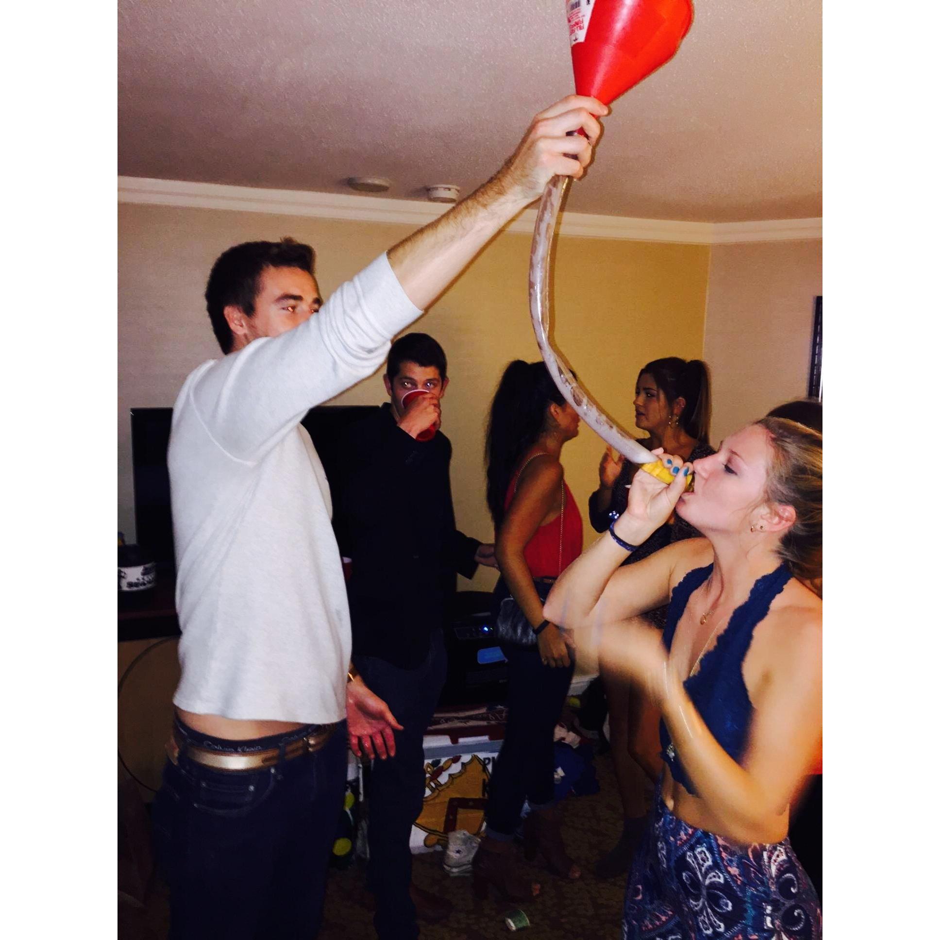 Helping with Ashton's first beer bong :)