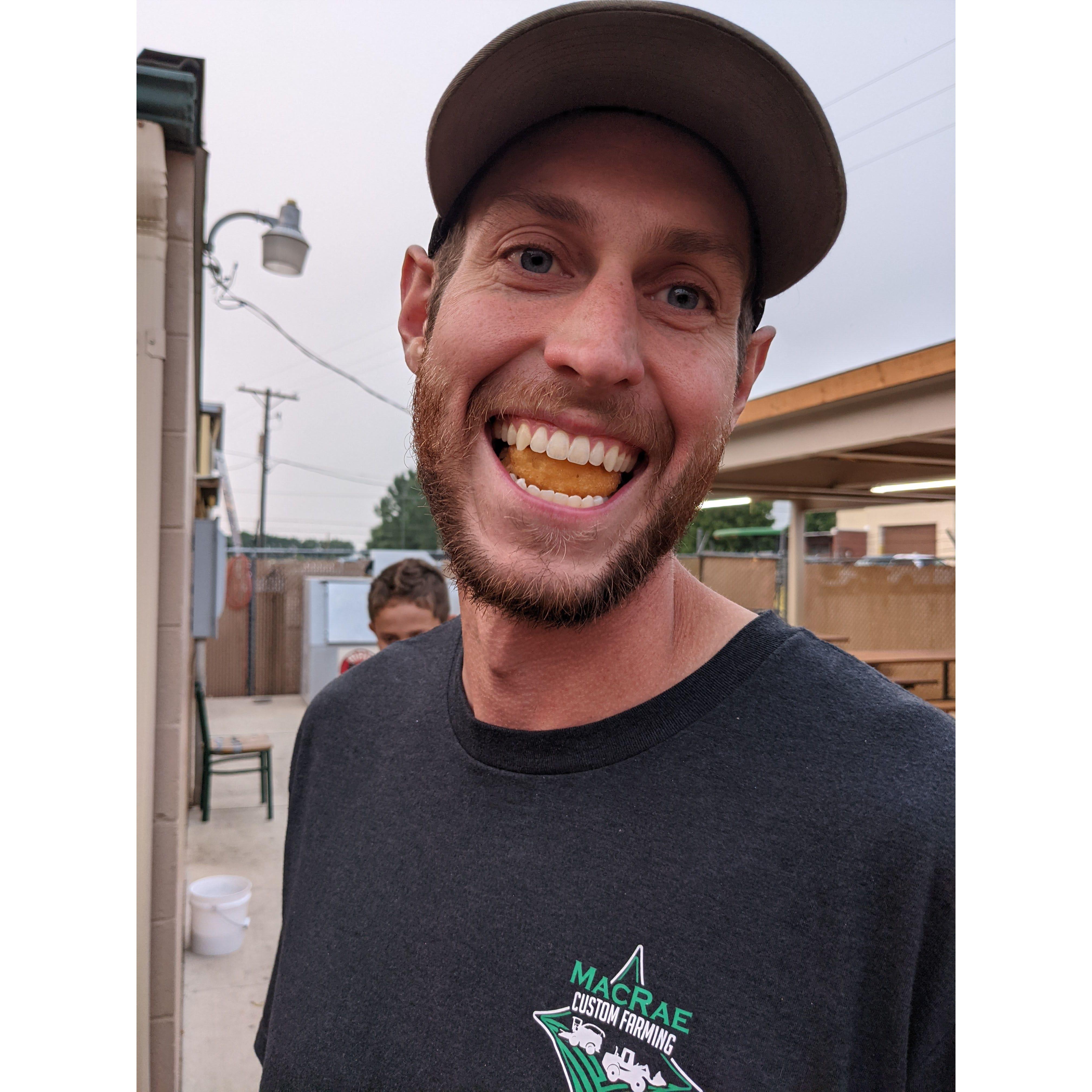 A gem of a photo. Casey and a mini donut at the Minidoka County Fair:)