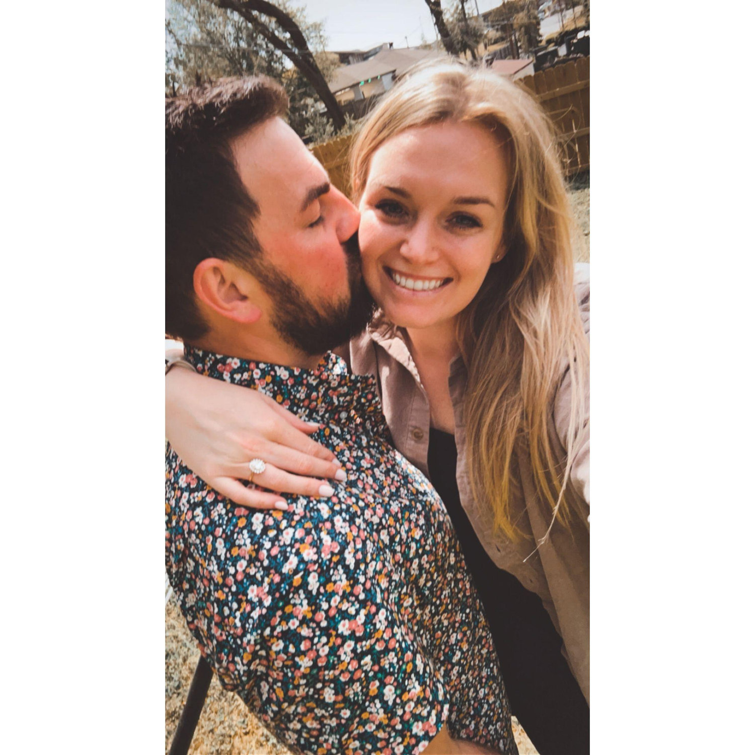 We took this photo right after Ryan proposed. He had set up a picnic with a line of roses to the blanket and proposed right before the eclipse!