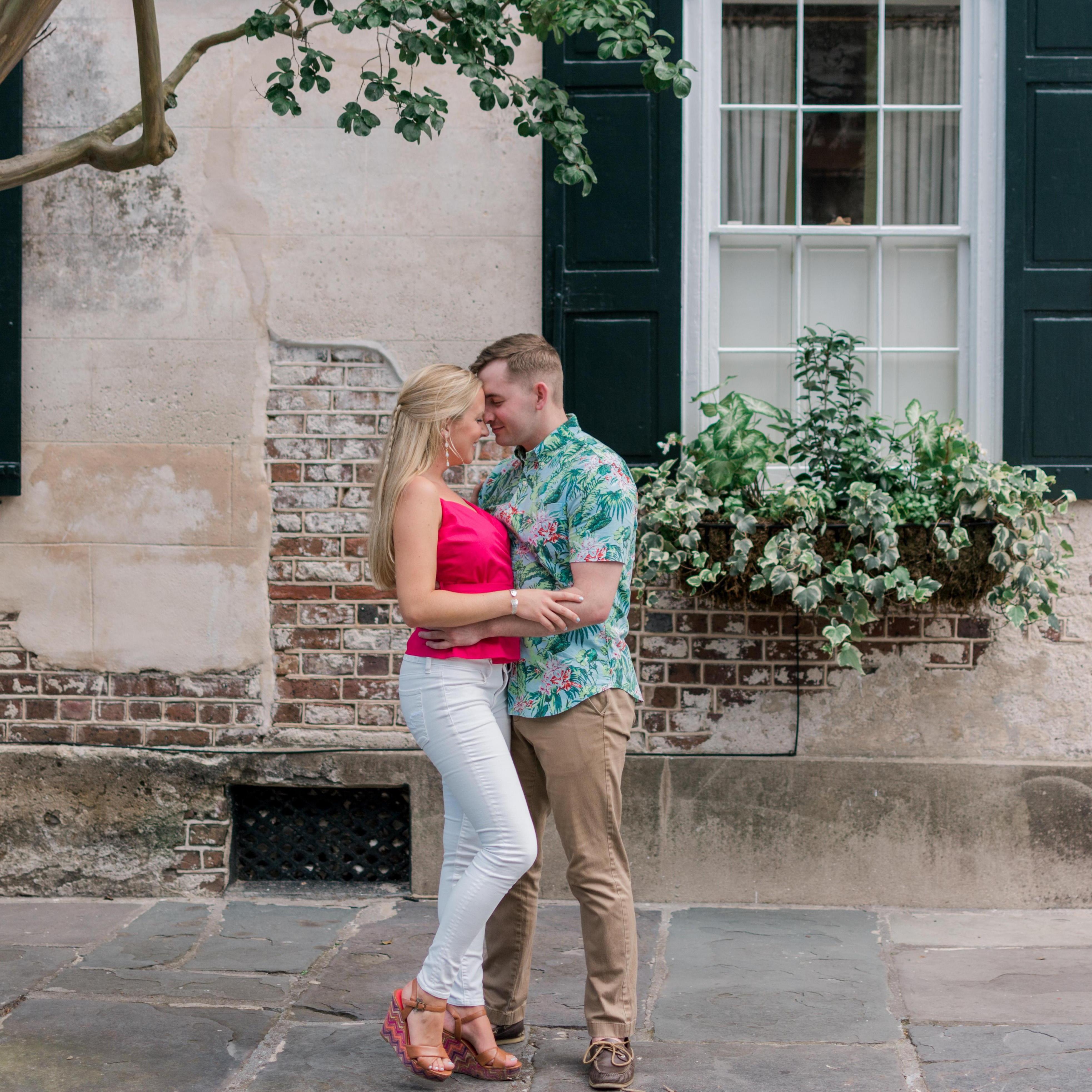 The two walked around historic downtown Charleston for their engagement photos. It was all Erin's idea, of course.