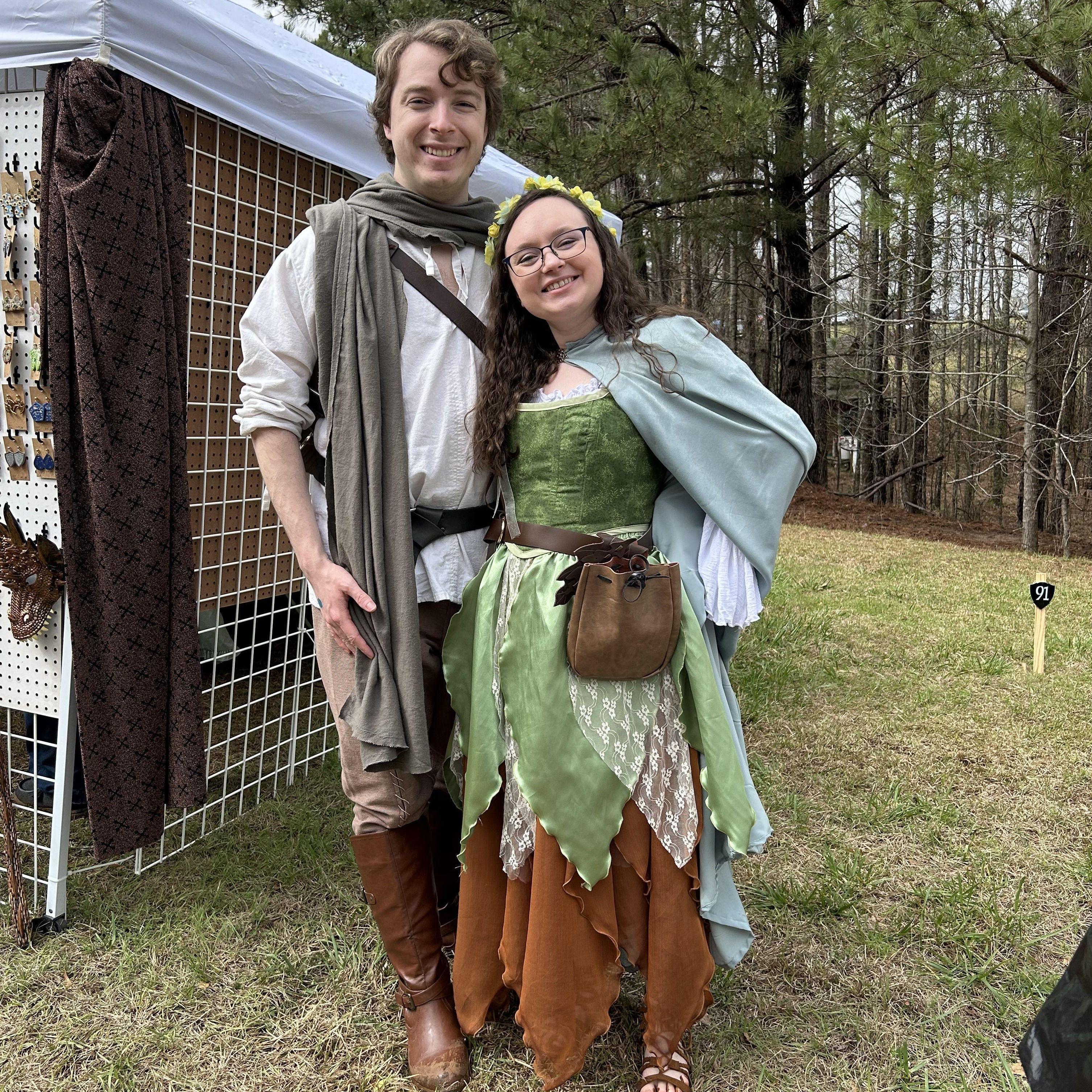 Mom and dad's first ren fair! I made my corset and cloak. Also it was egregiously muddy. - C 🩵 (3/2/2024)