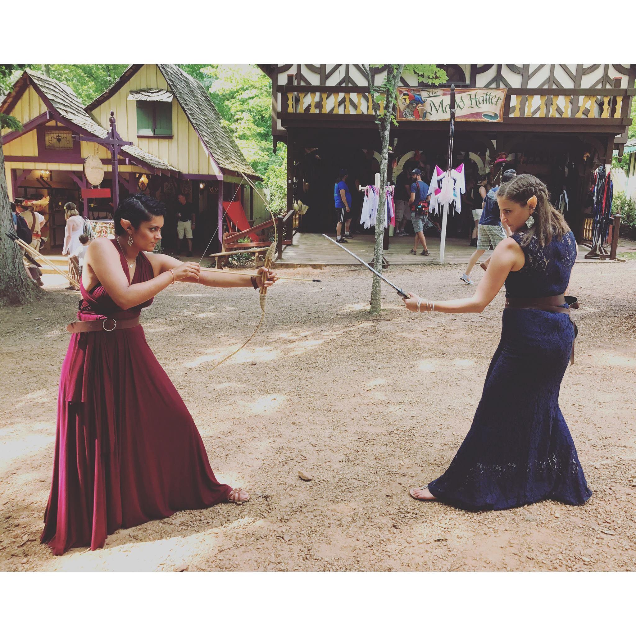 Dueling at the Renaissance Festival. They take every opportunity to wear elf ears.