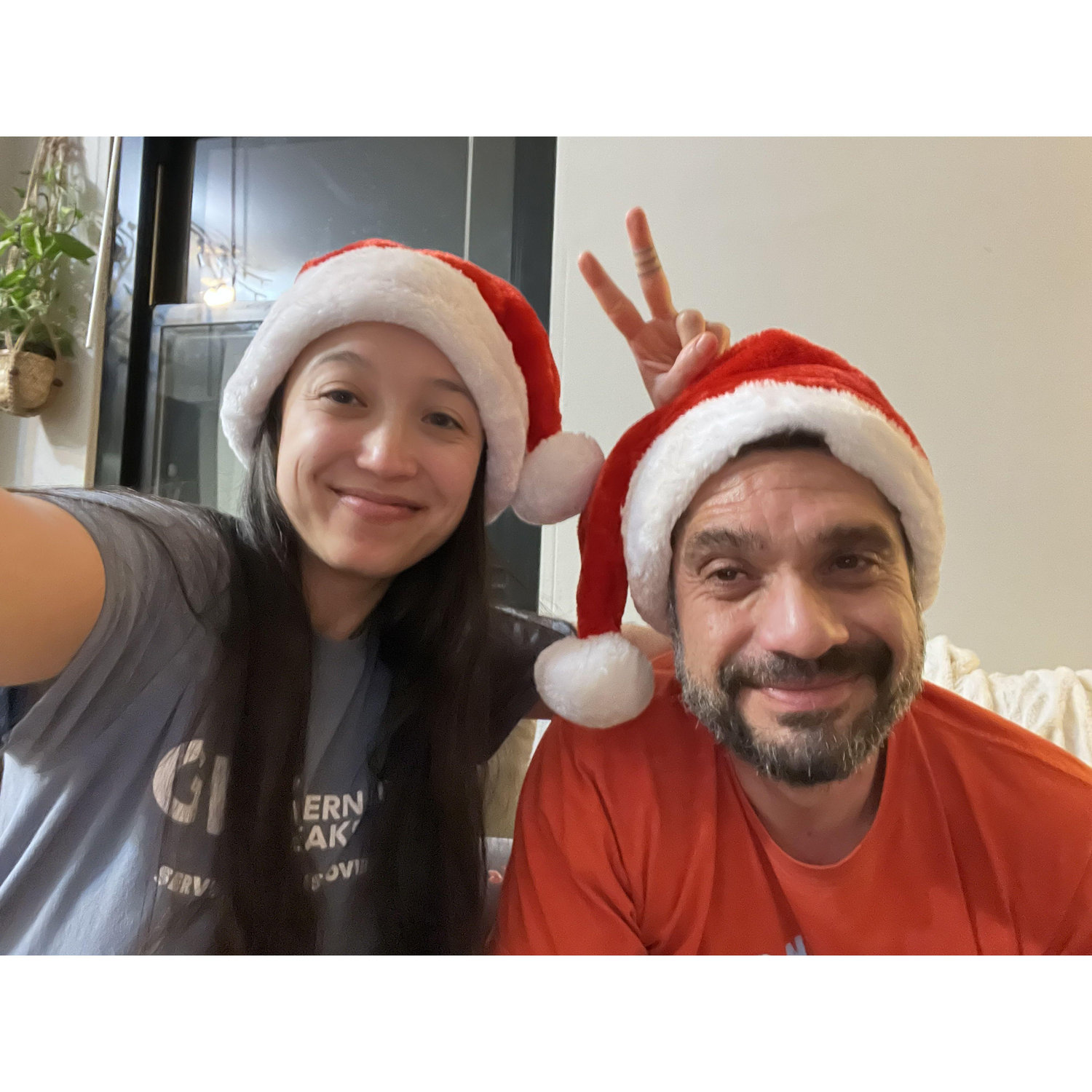 Trinady forces Michael to wear a Santa hat