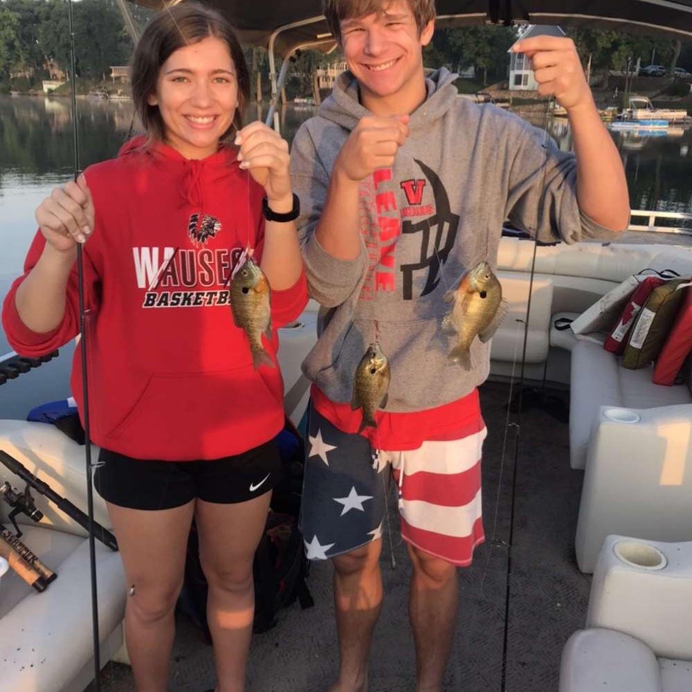 Levi taught Emily how to fish and then showed off by catching two at once