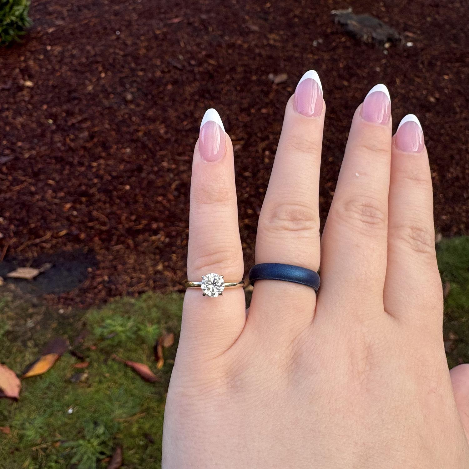 The ring needed to be resized, but it didn’t stop me from wearing it!
Jonathan and I have matching blue silicone bands, which got quite a bit of use when the ring was at the jewelers!