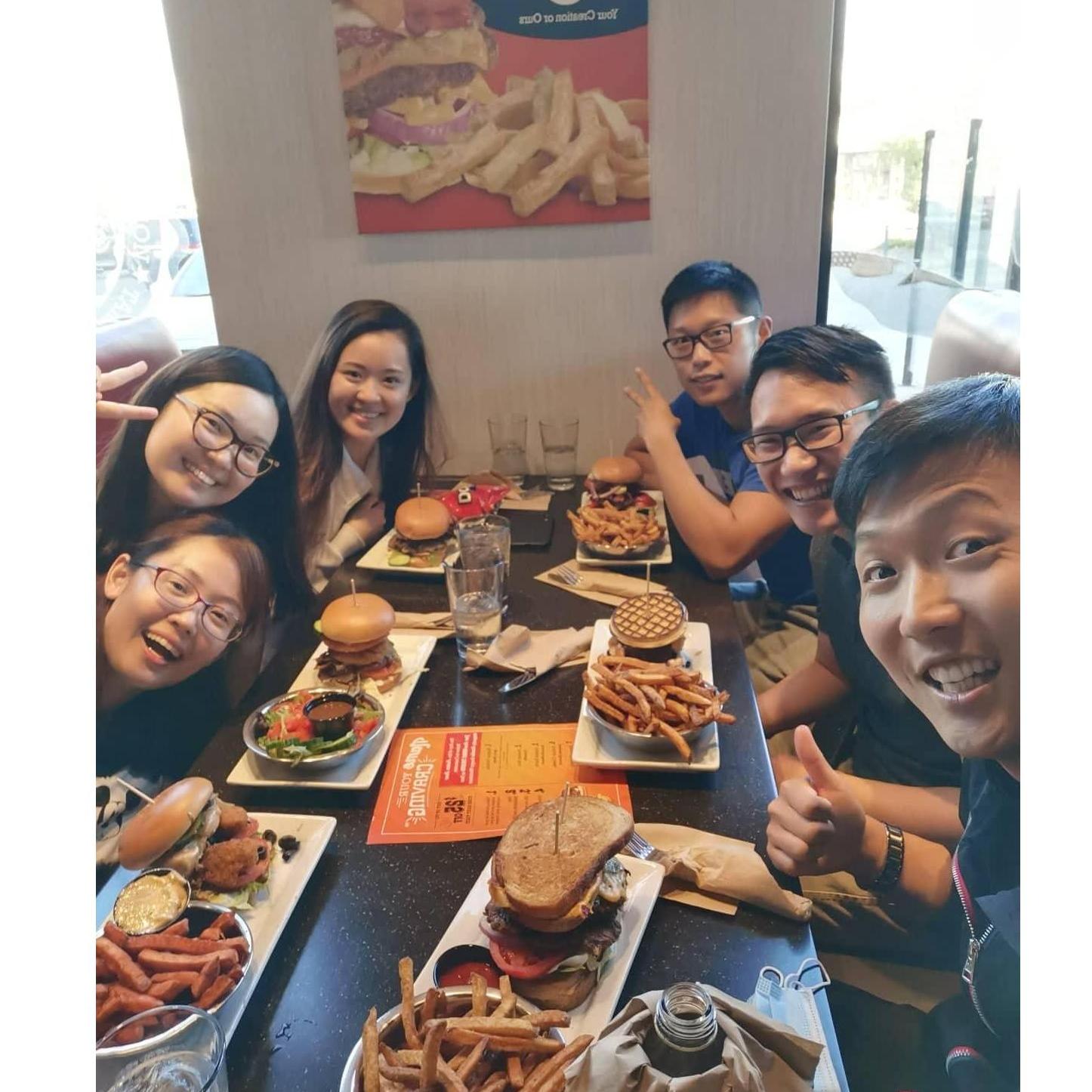 Having huge burgers together!