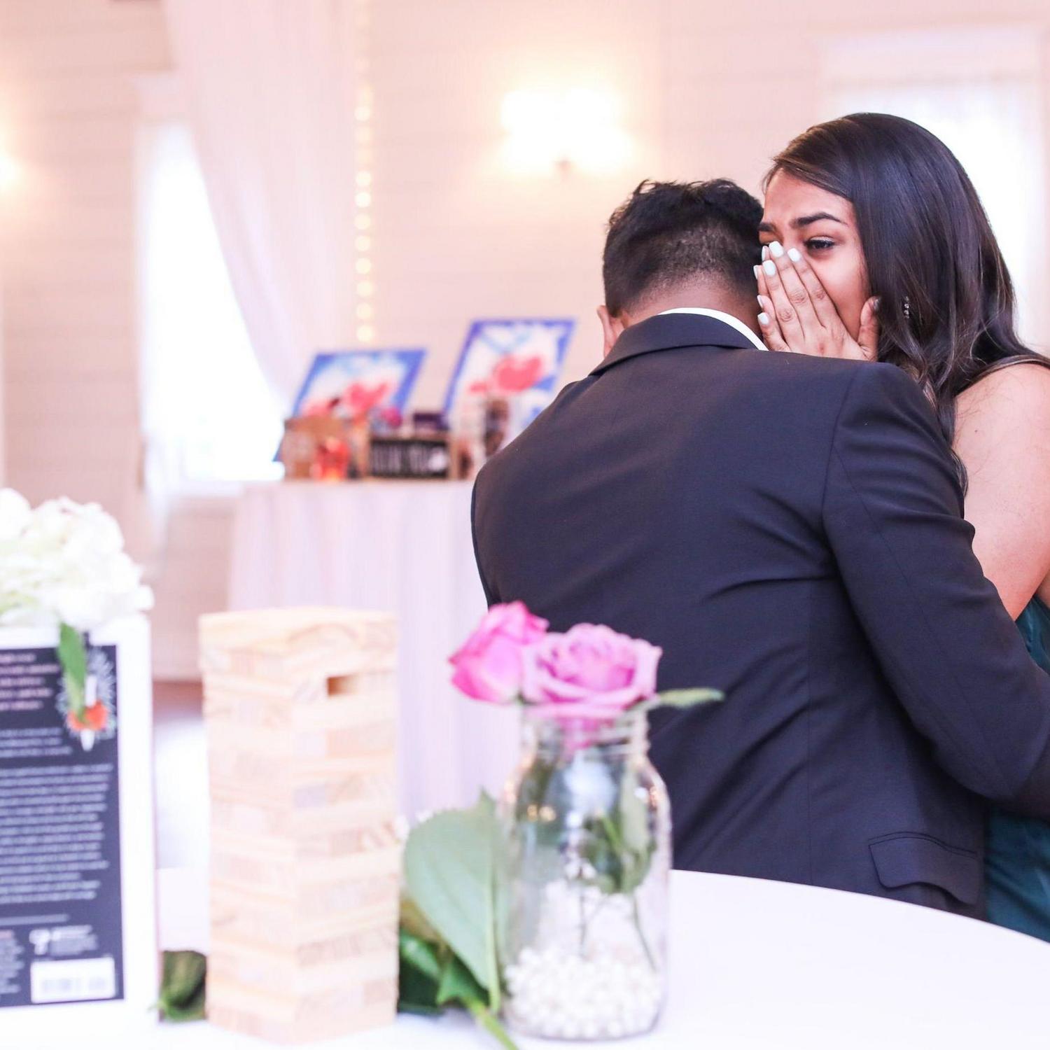 April 2022 | An emotional moment for D during the proposal. Hirsh had already been walking her down memory lane -this was right after she realized that her ENTIRE family was hiding behind the scenes!!