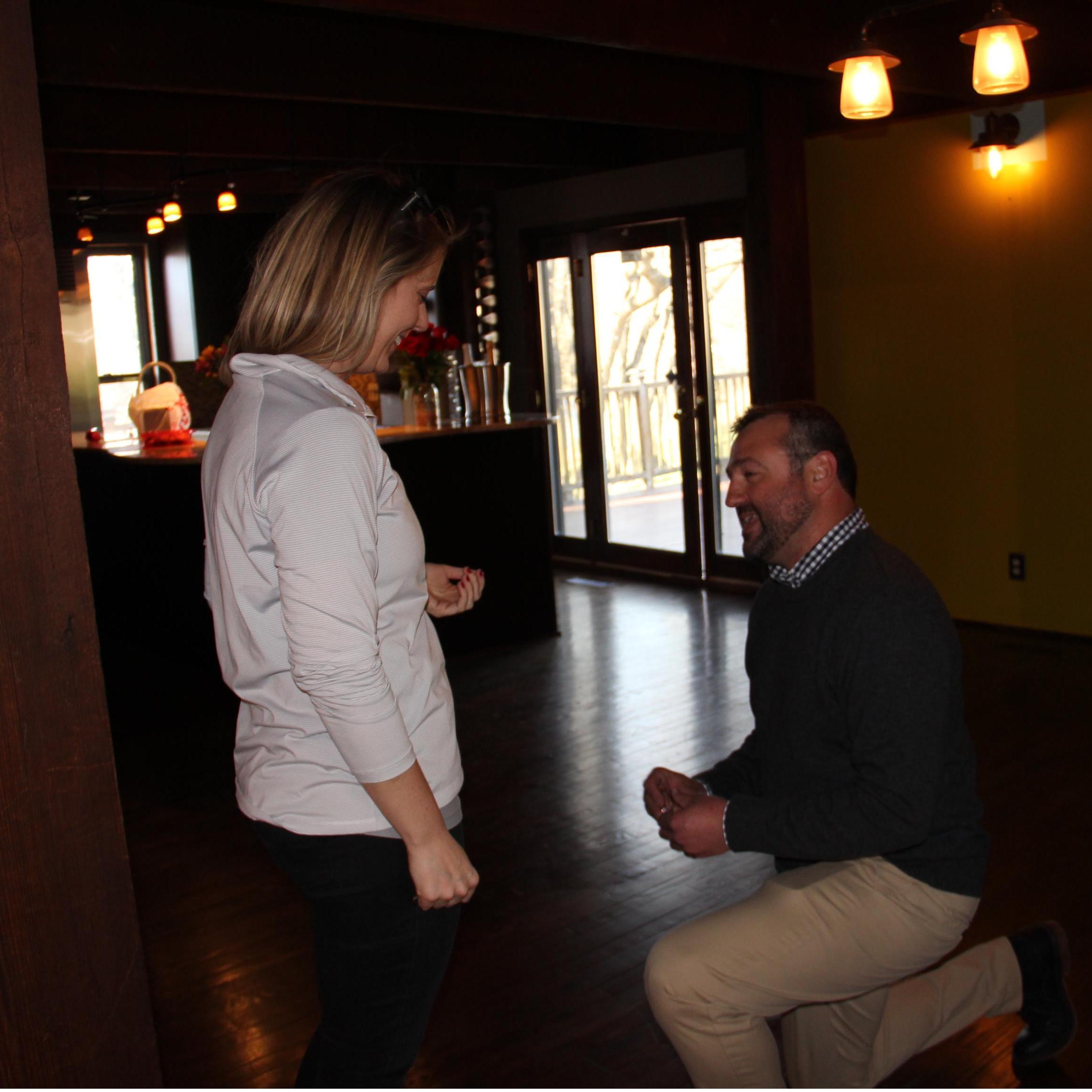 John down on his (good) knee proposing the day we closed on our home.