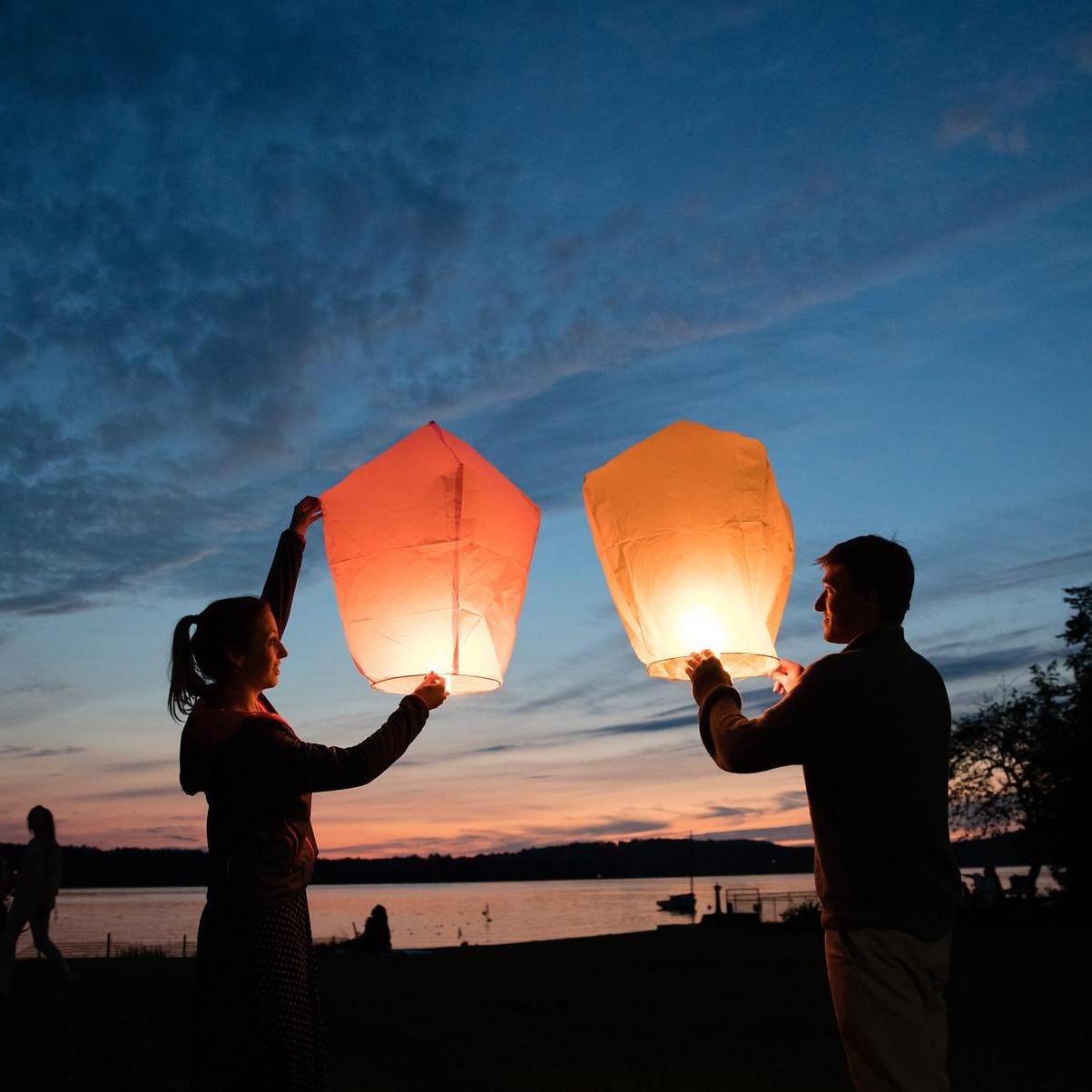 Launching floating lanterns in Vermont