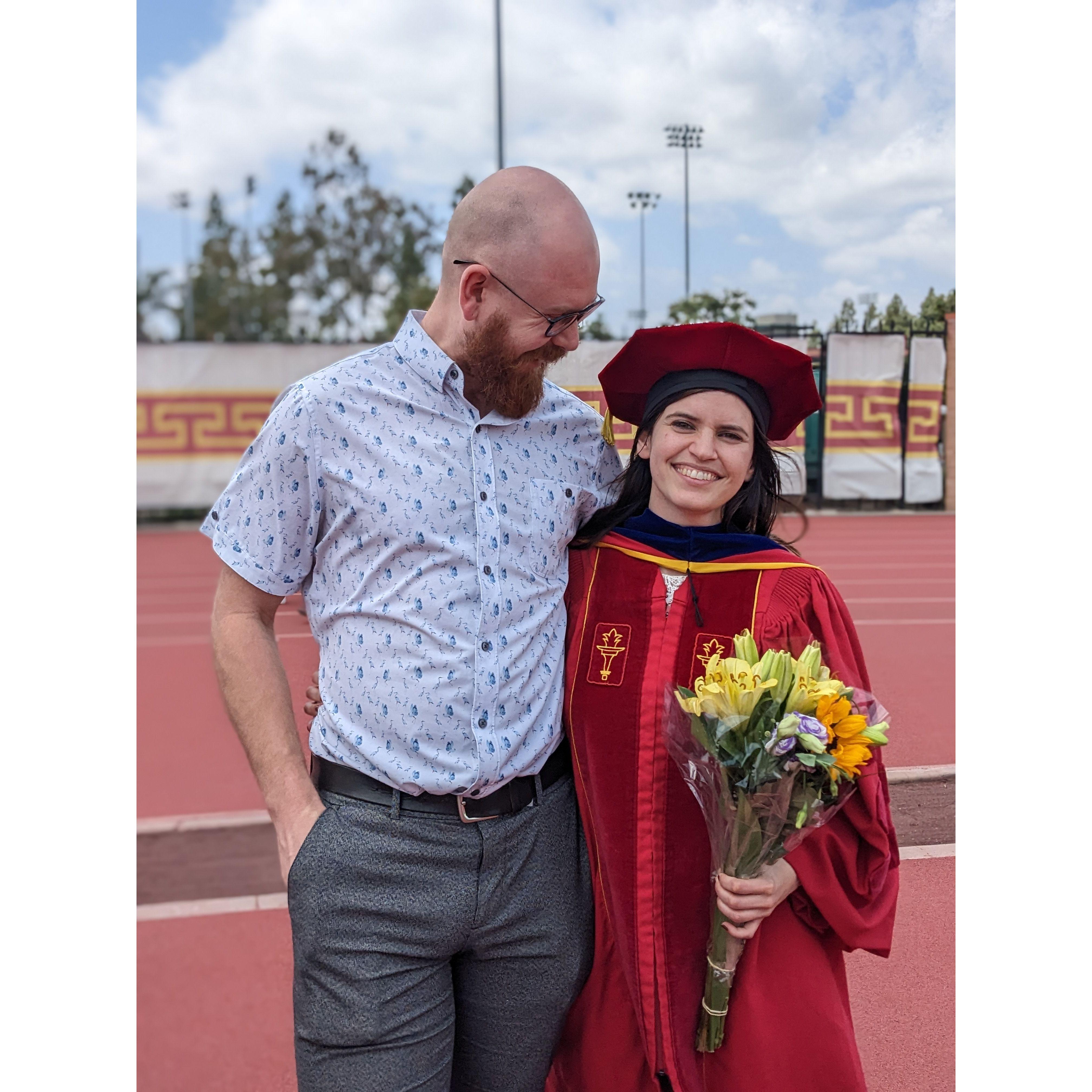 Celebrating Mary's PhD graduation at USC in May 2023. Mary's favorite day to date!