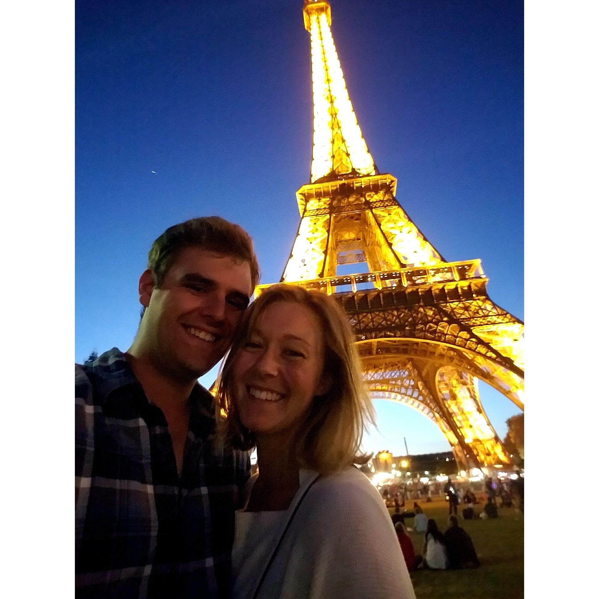 Paris, FR, visiting the Eiffel Tower at night