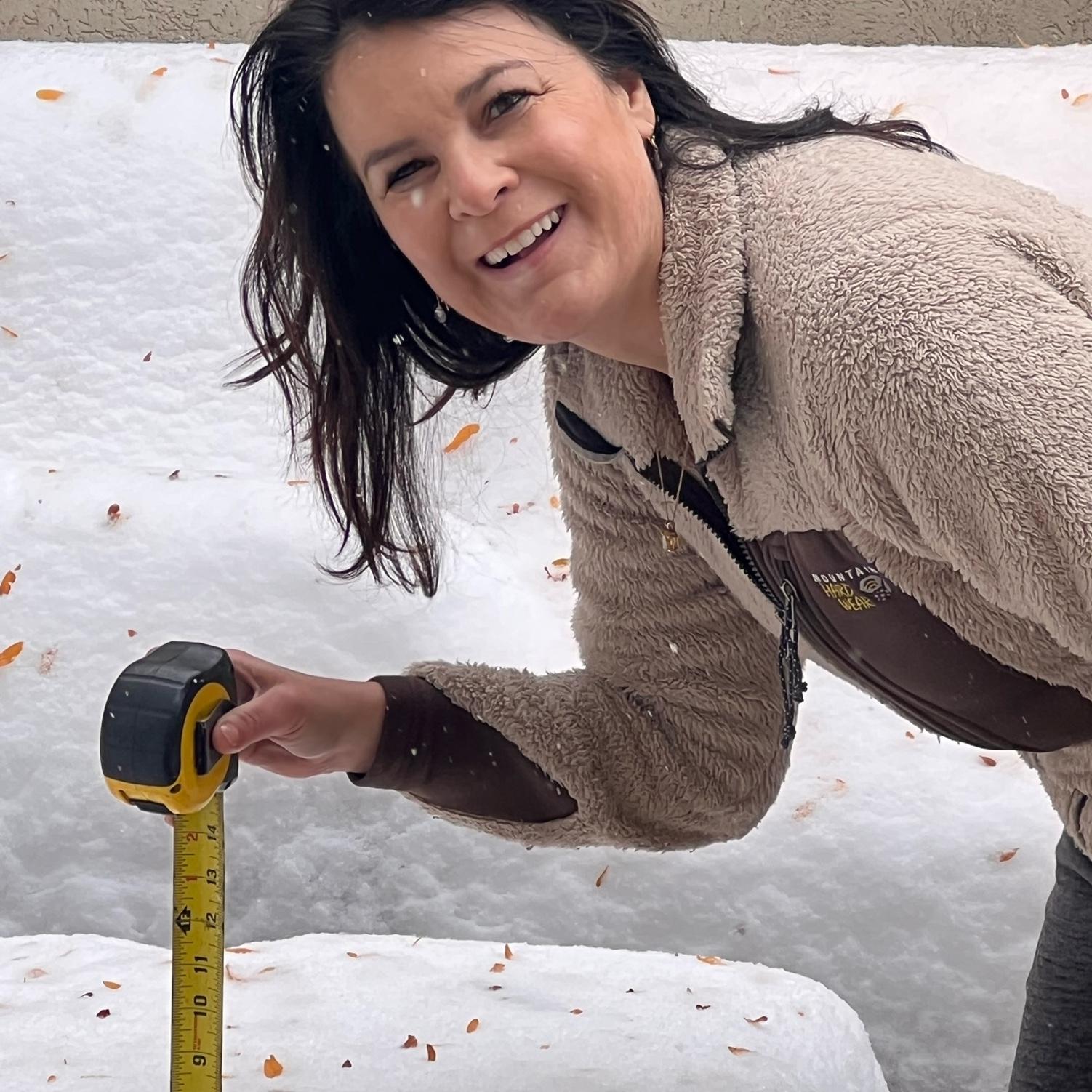 Kim sending her mom exact measurements of snowfall.